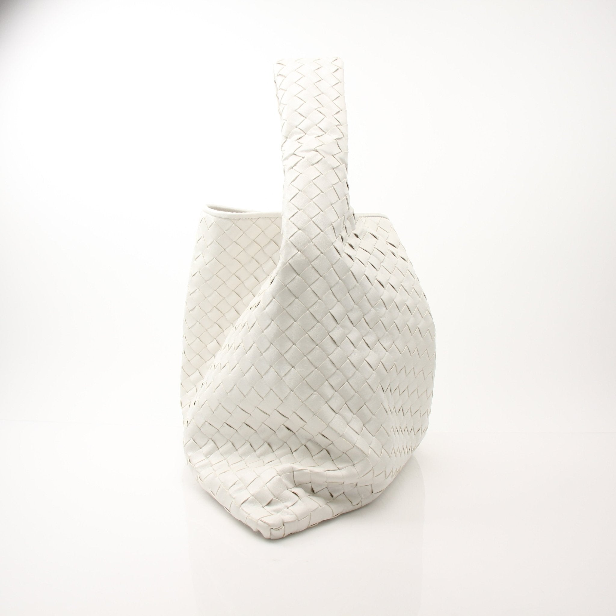 Large white Bottega Veneta Intrecciato leather hobo bag with spacious design and woven texture, shown on a plain background.