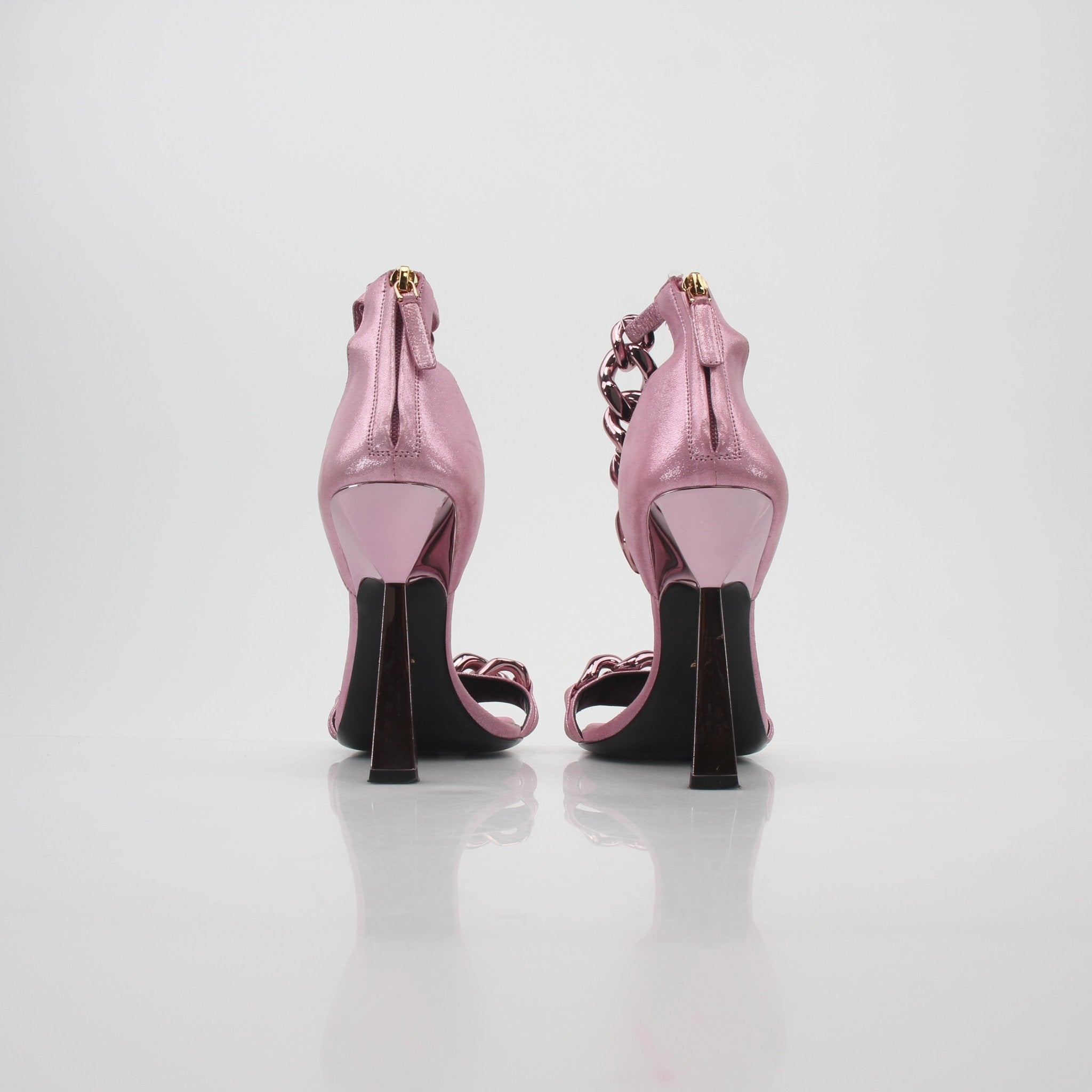 Gold & Beyond Versace pink Medusa chain heels featuring stylish straps and a high stiletto heel.