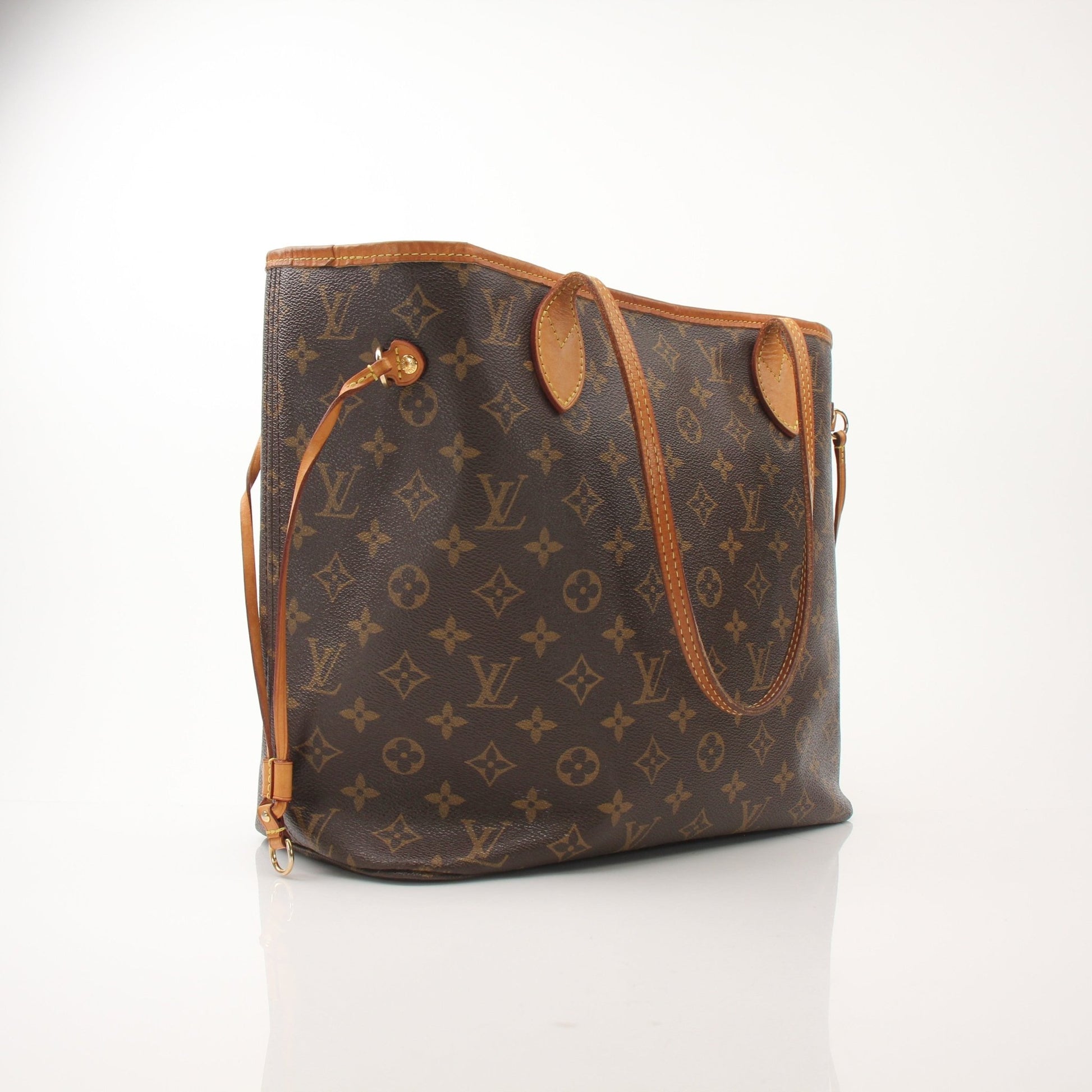 Louis Vuitton Neverfull MM tote handbag with leather trim and signature monogram pattern, displayed on a neutral background.