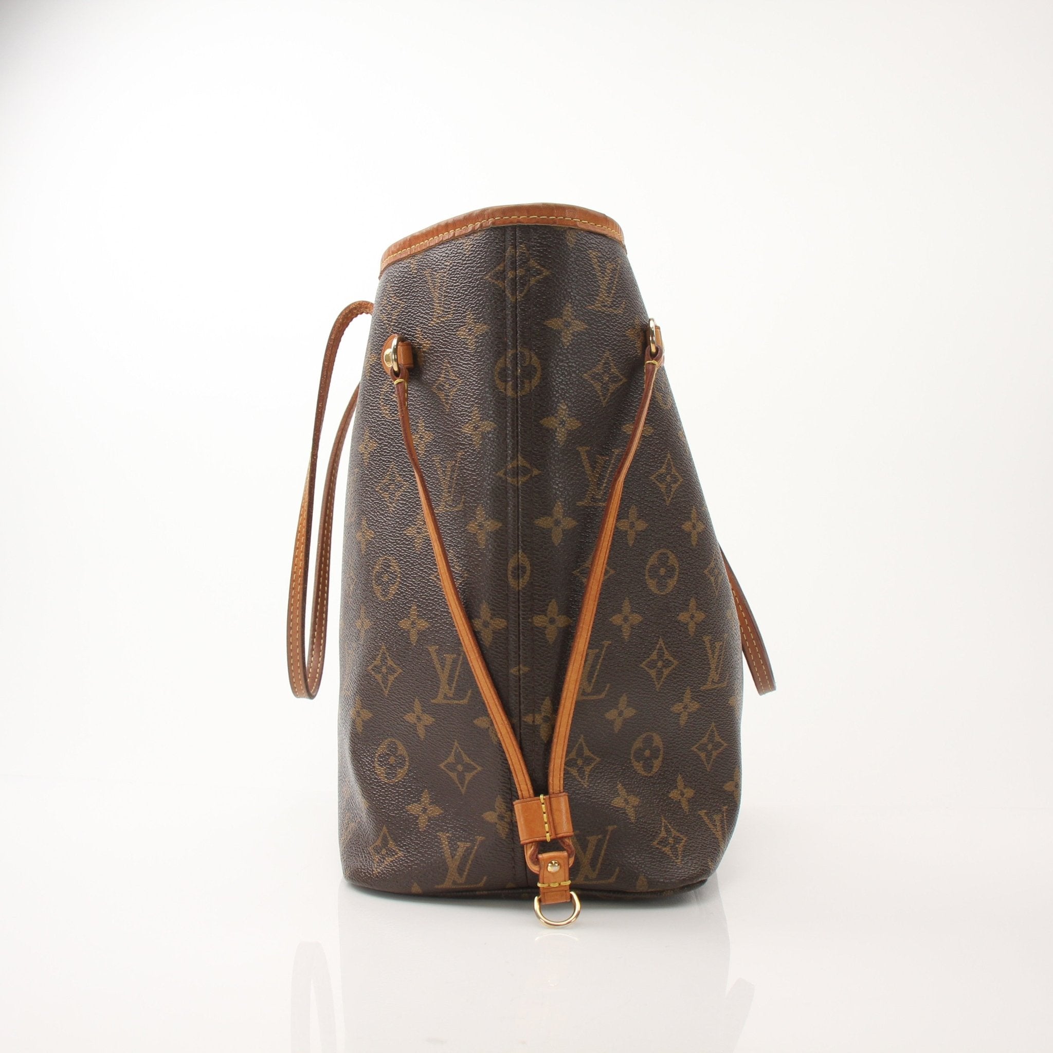 Louis Vuitton Neverfull MM tote handbag in classic monogram canvas with leather trim, displayed against a neutral background.
