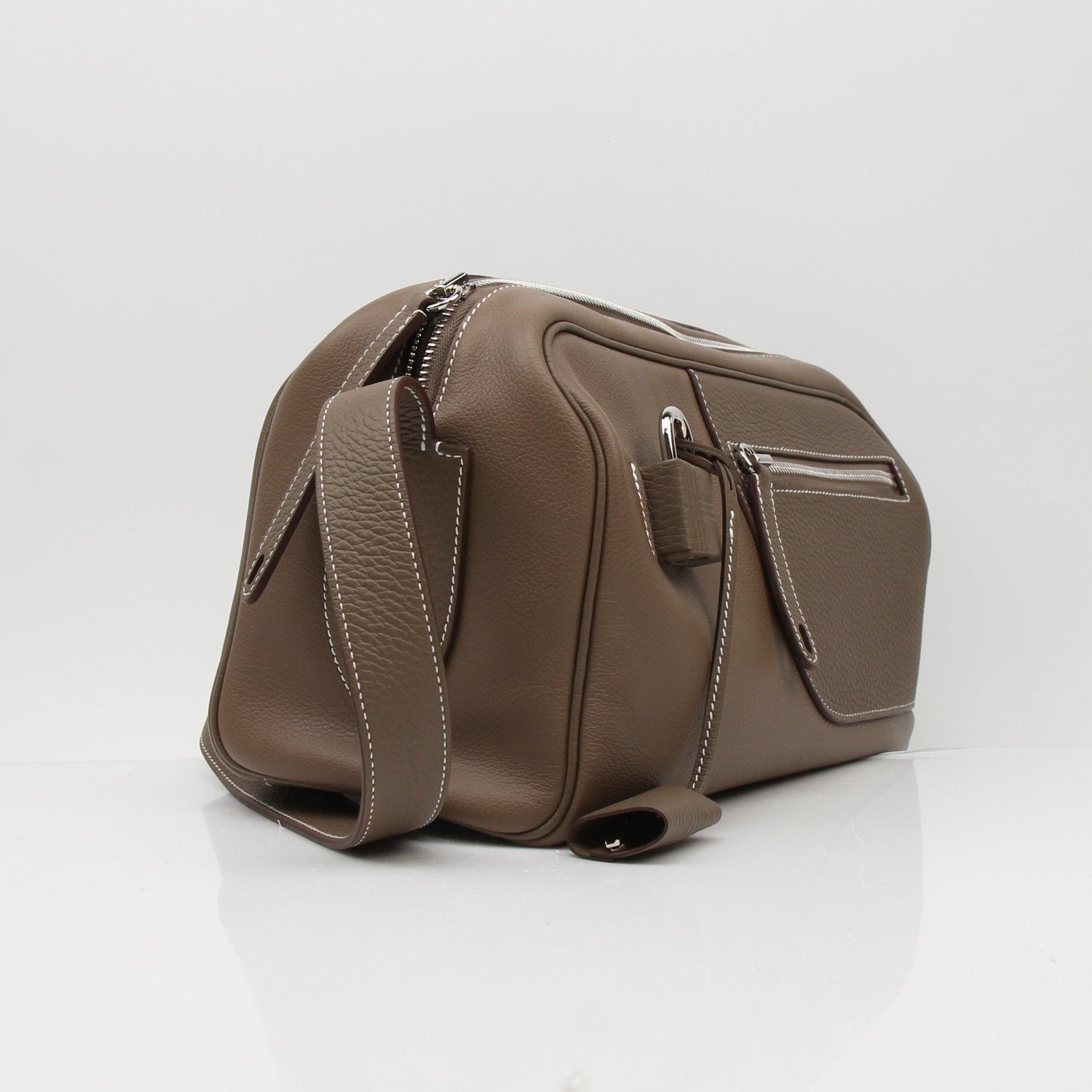Hermès Petite Courrier handbag by Gold & Beyond, showcasing its luxurious leather exterior and elegant design.