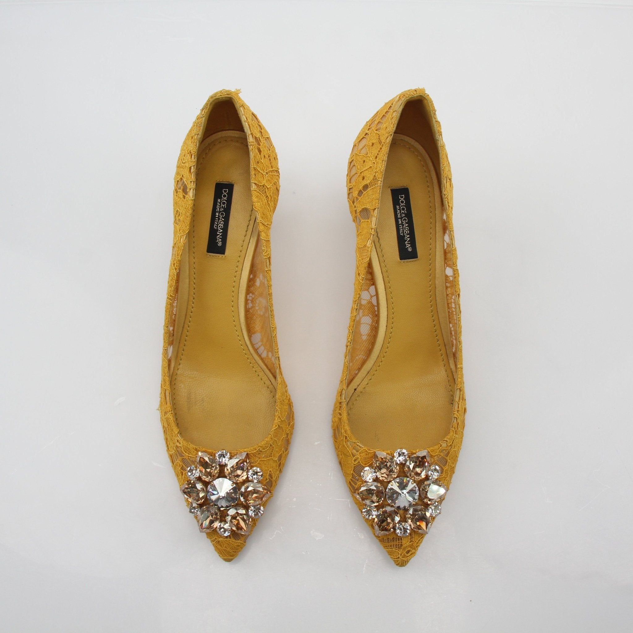 Gold & Beyond Dolce & Gabbana yellow Taormina lace embellished pumps with elegant high heels and intricate lace details.
