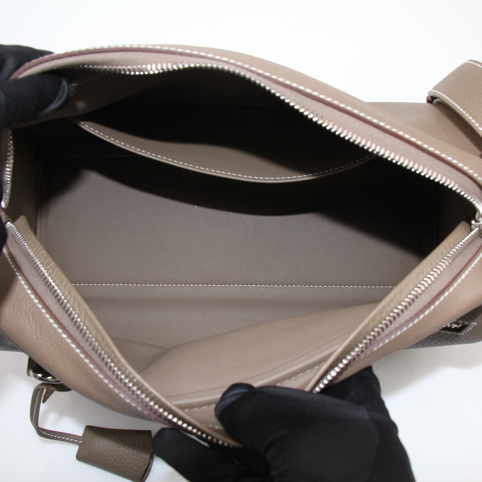 Hermès Petite Courrier handbag by Gold & Beyond, showcasing a luxurious leather design with gold-tone hardware and a compact, stylish shape.