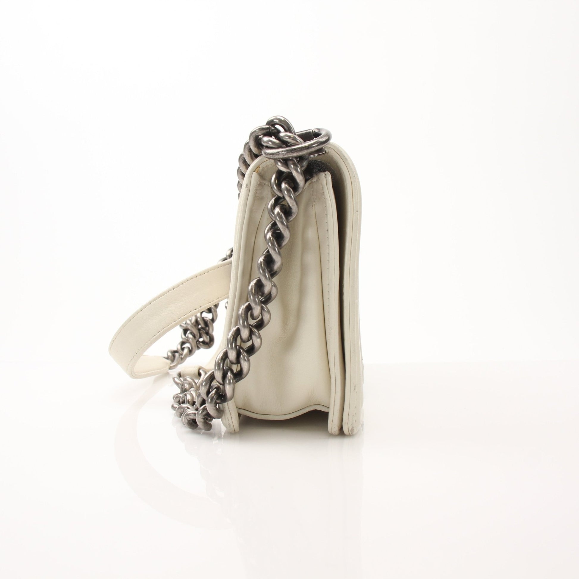 Gold & Beyond Chanel Quilted Mini Flap Handbag with gold chain strap and signature quilted pattern on soft leather.