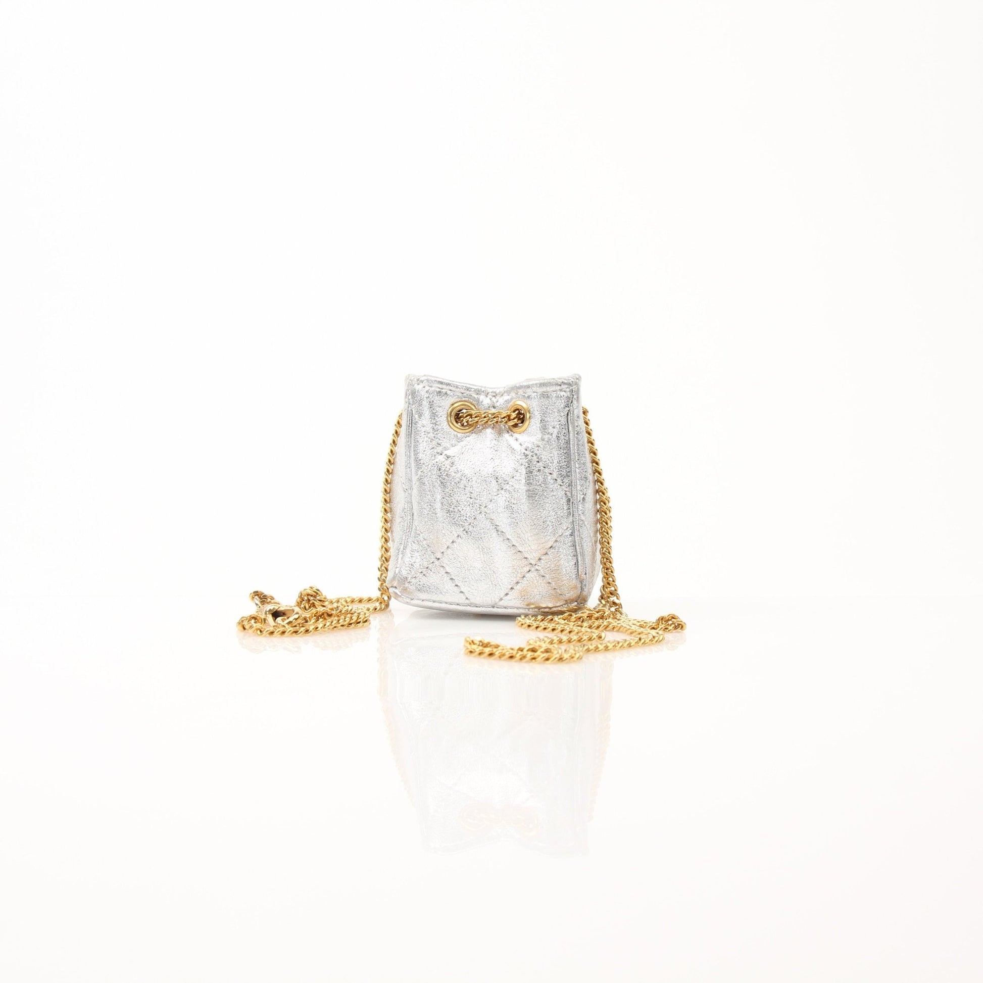 Gold & Beyond Chanel micro quilted drawstring pouch, stylish accessories with a quilted design and drawstring closure.