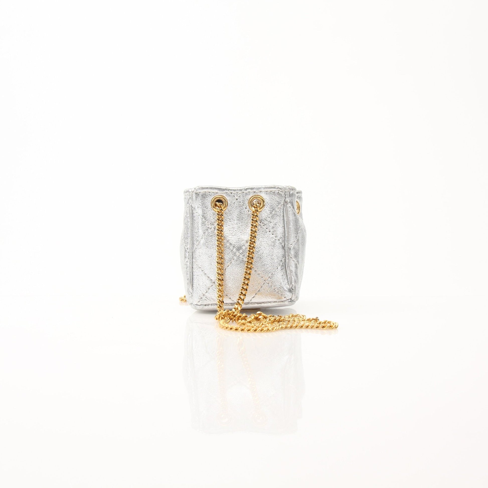 Gold & Beyond Chanel Micro Quilted Drawstring Pouch, luxury accessory with quilted design and drawstring closure.