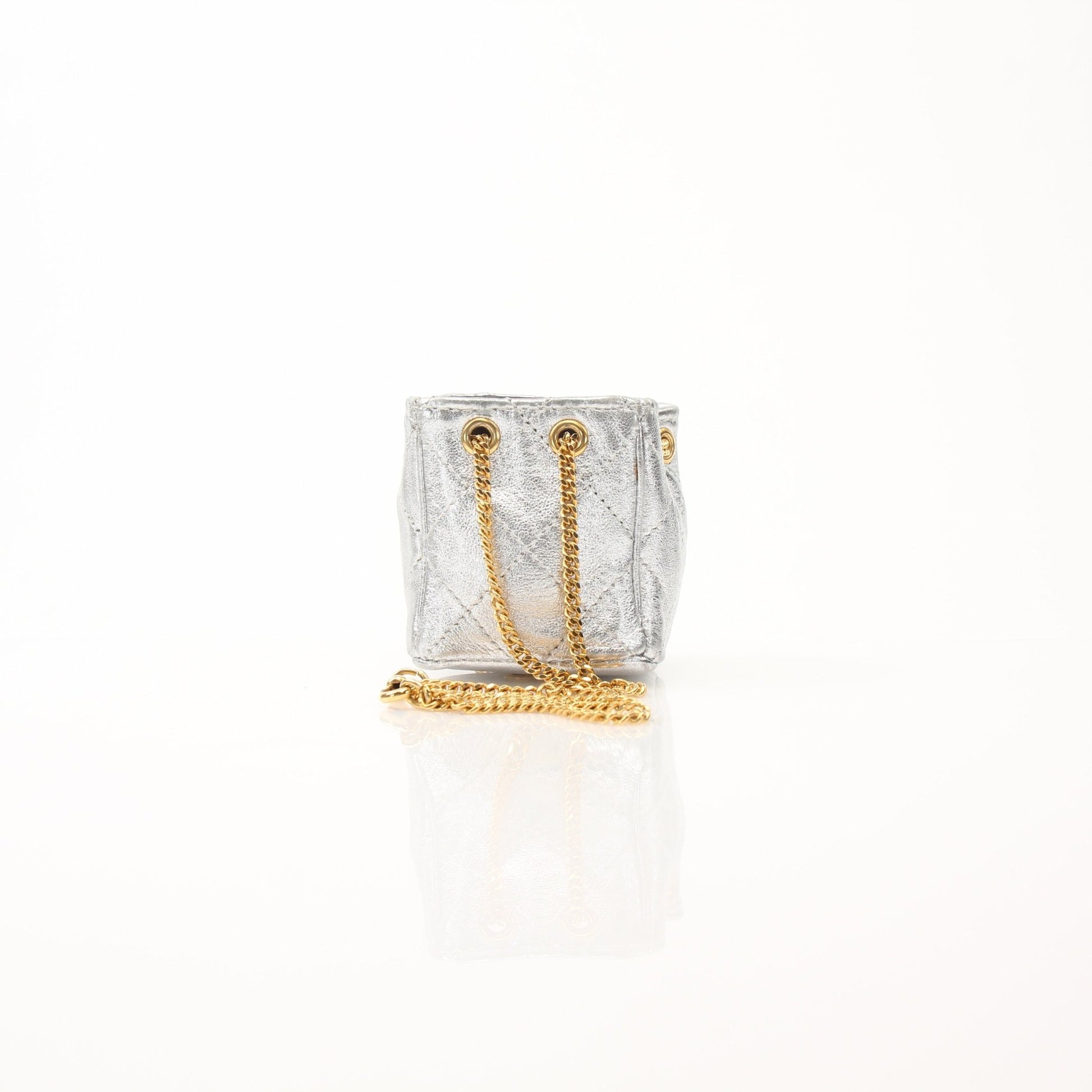 Gold & Beyond Chanel micro quilted drawstring pouch, stylish accessories with a textured quilted pattern and drawstring closure.