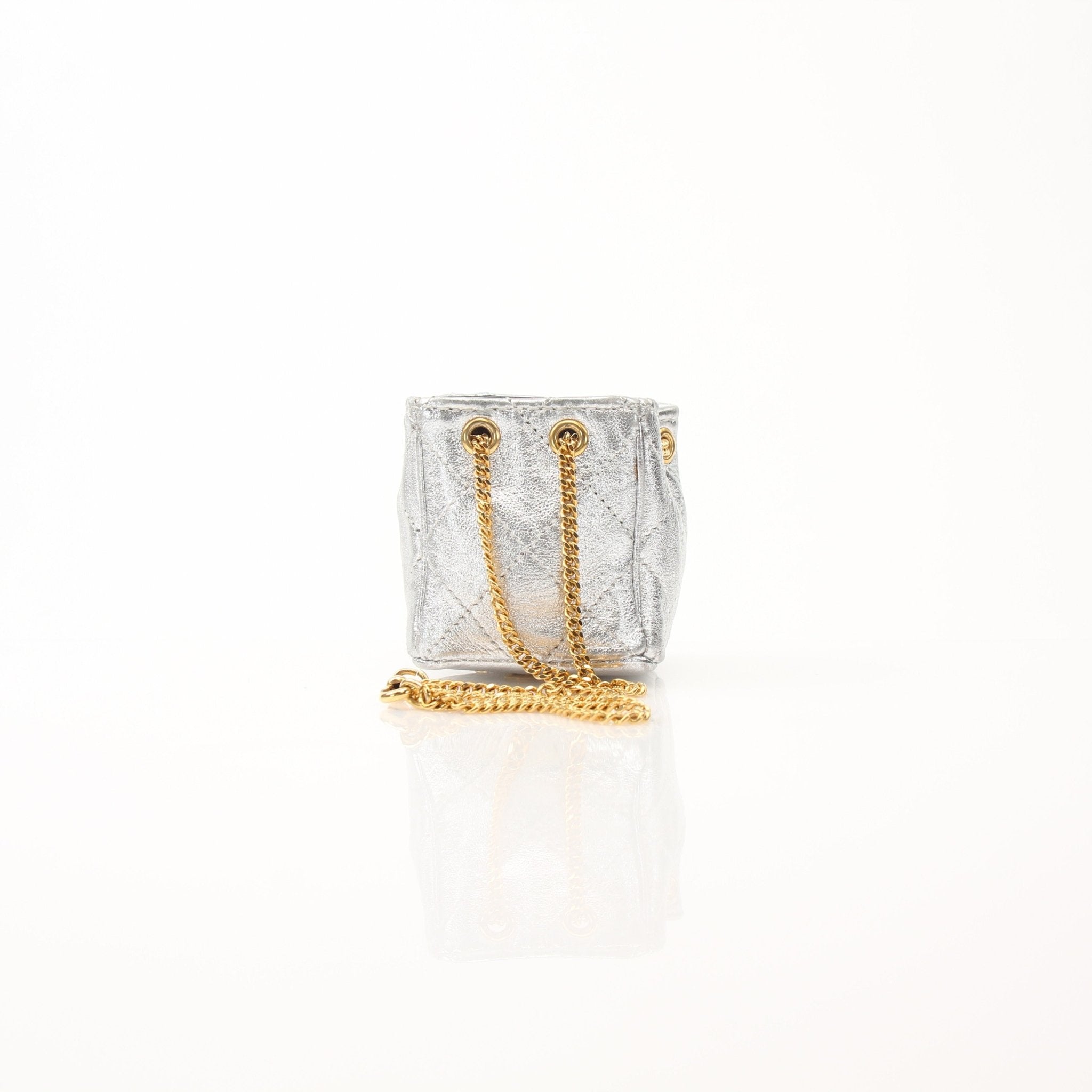Gold & Beyond Chanel micro quilted drawstring pouch, stylish accessories with a textured quilted pattern and drawstring closure.