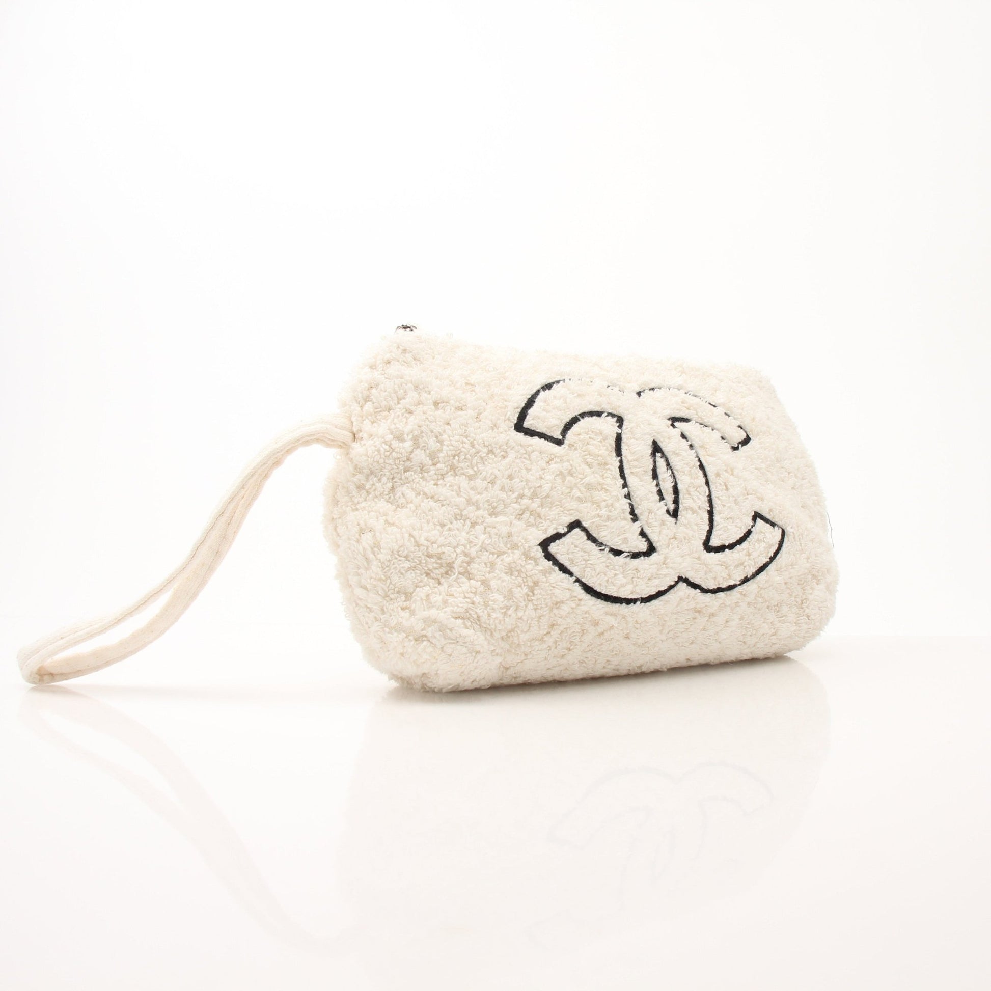 Gold & Beyond Chanel Terry Cloth CC Pochette handbag with beige and black fabric, featuring the iconic CC logo and wrist strap.