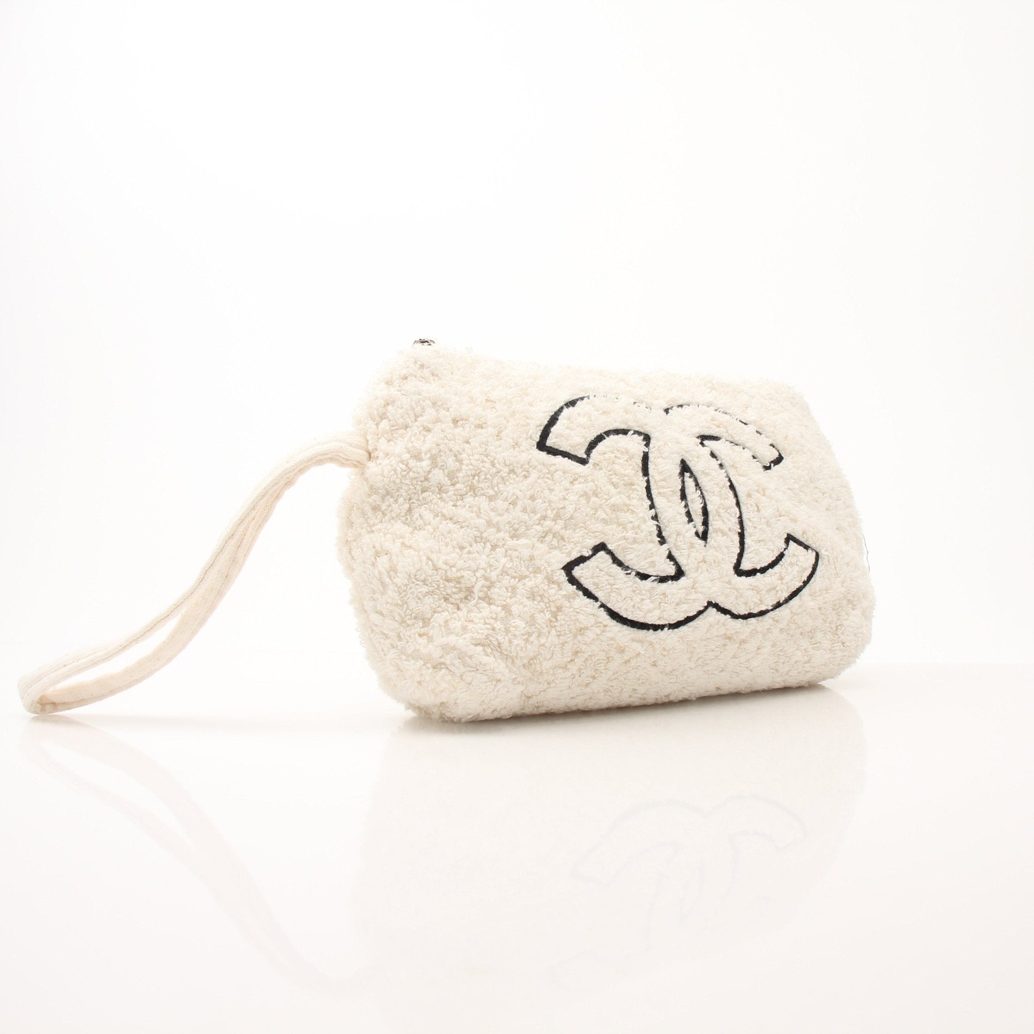 Gold & Beyond Chanel Terry Cloth CC Pochette handbag with beige and black fabric, featuring the iconic CC logo and wrist strap.
