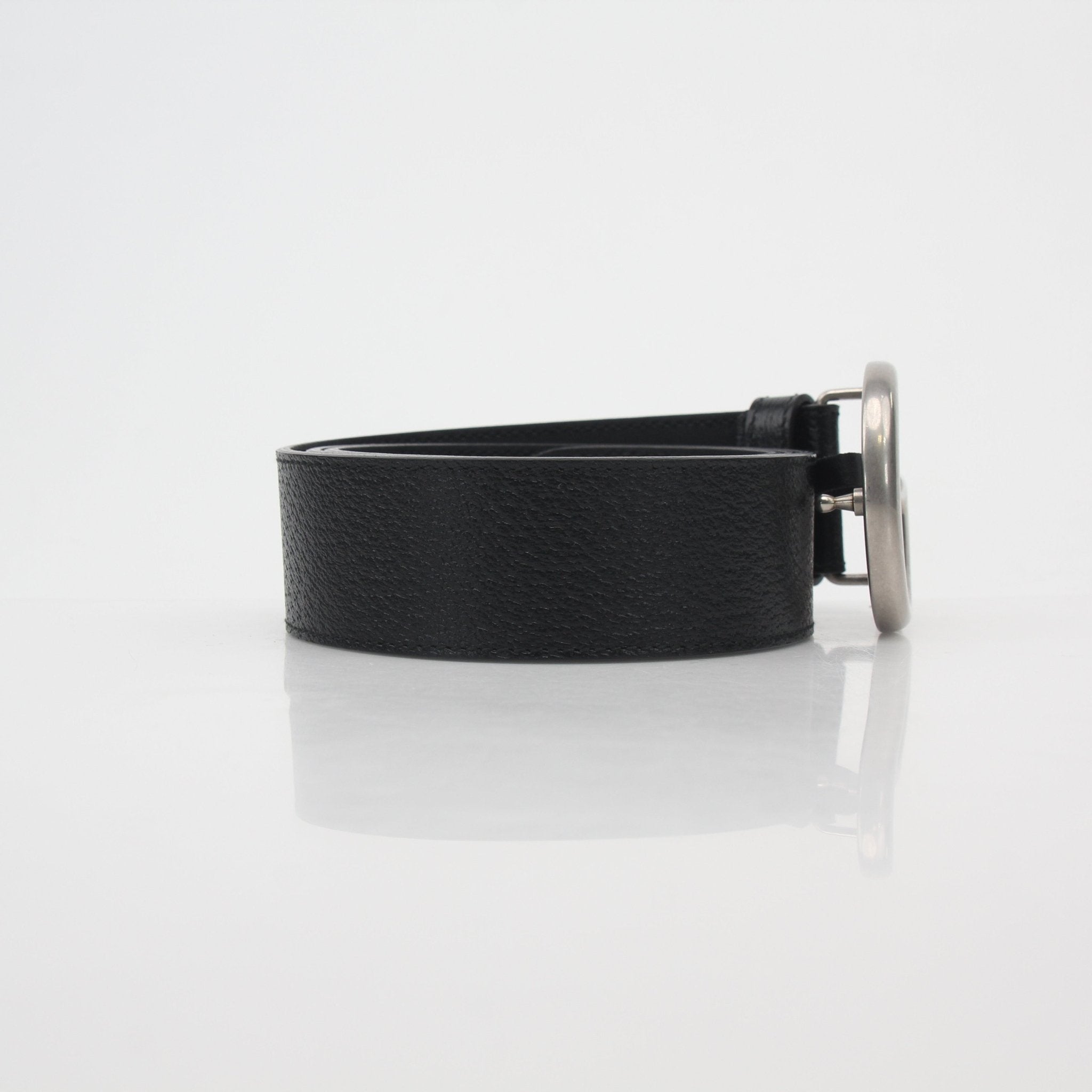 Black leather Gucci GG Marmont belt with gold hardware, stylish accessories for men and women.