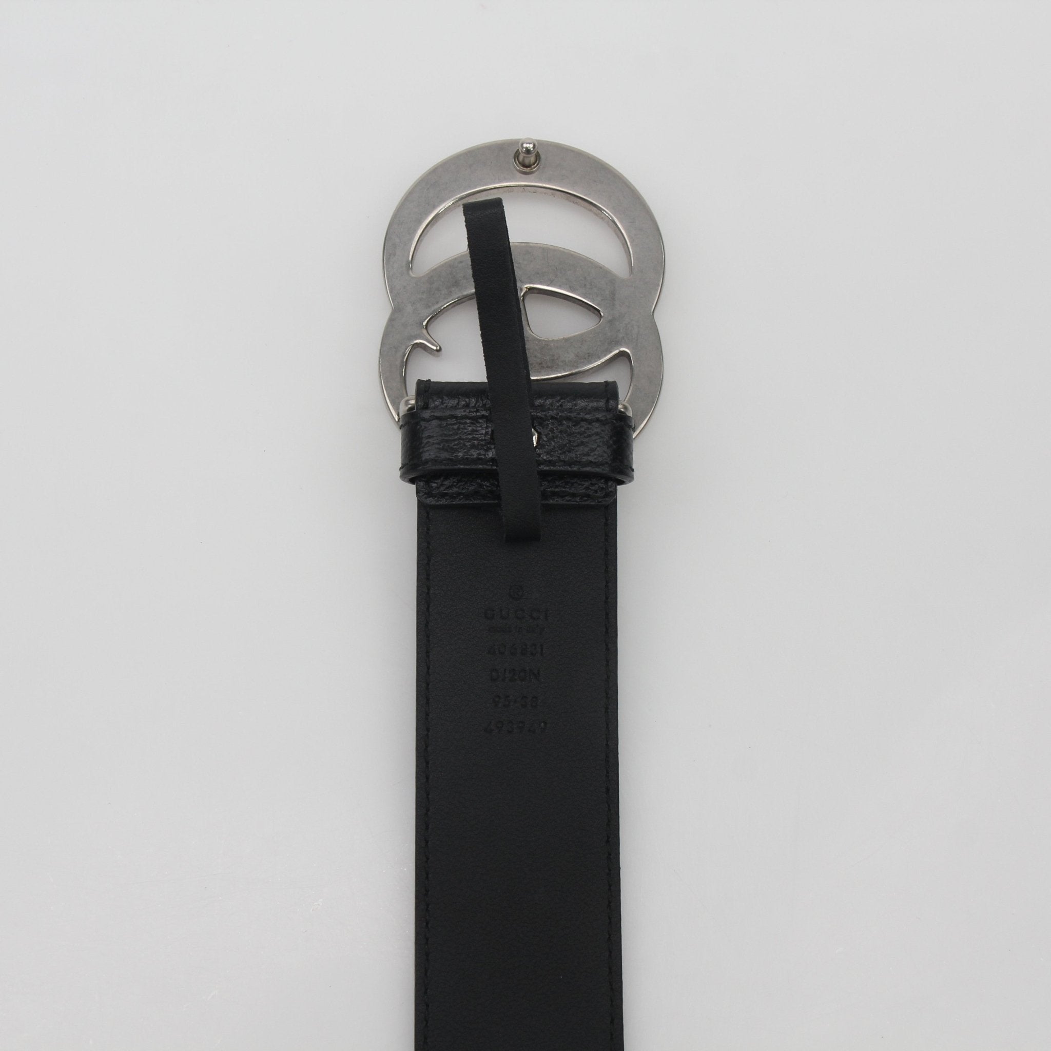 Black Gucci GG Marmont leather belt with gold-tone GG logo buckle, stylish accessory for men and women.