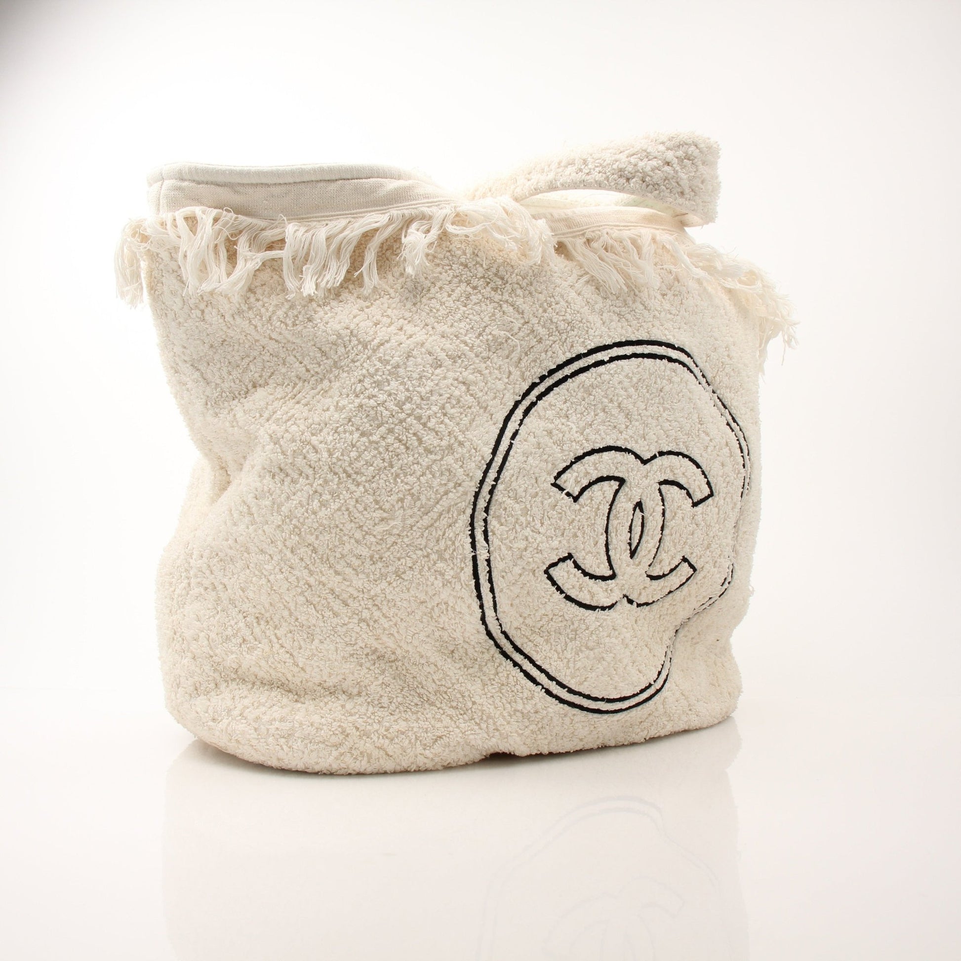 Gold & Beyond Chanel Terry Cloth CC beach tote handbag with woven handles and spacious interior, perfect for beach or casual outings.