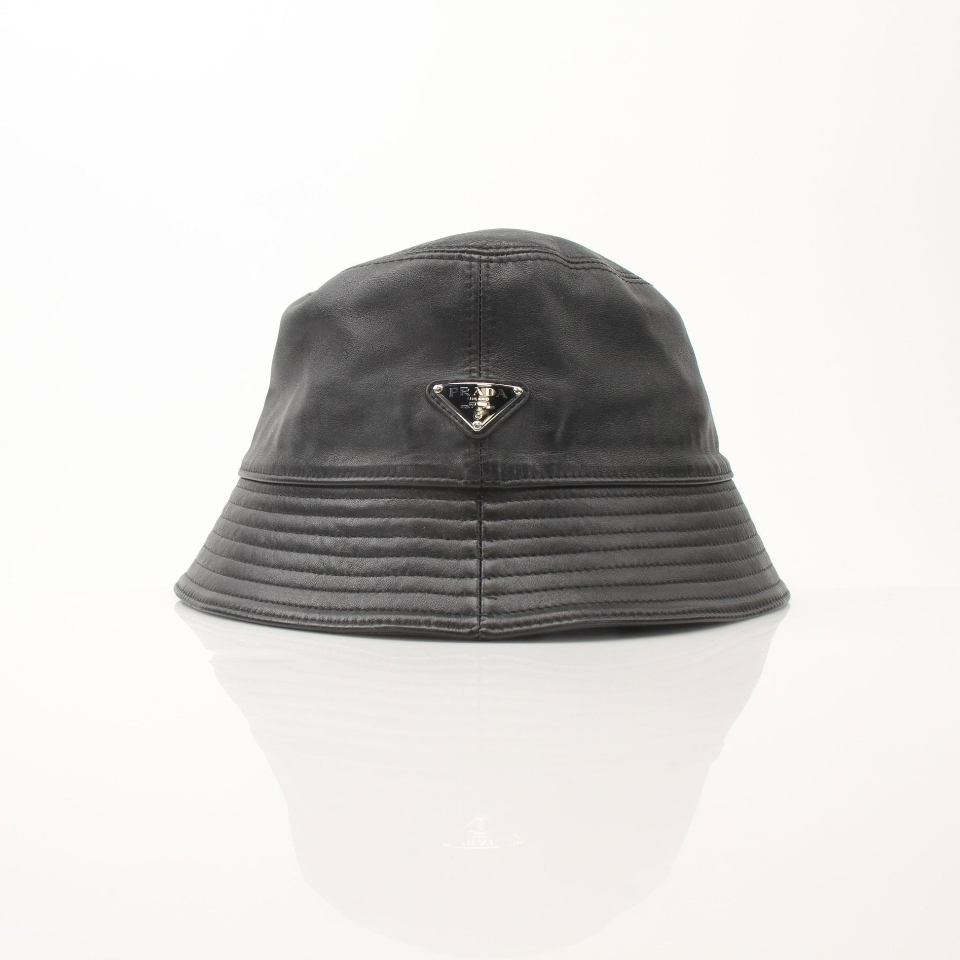 Prada black nappa leather bucket hat, stylish accessory with soft leather material, shown on a plain background.