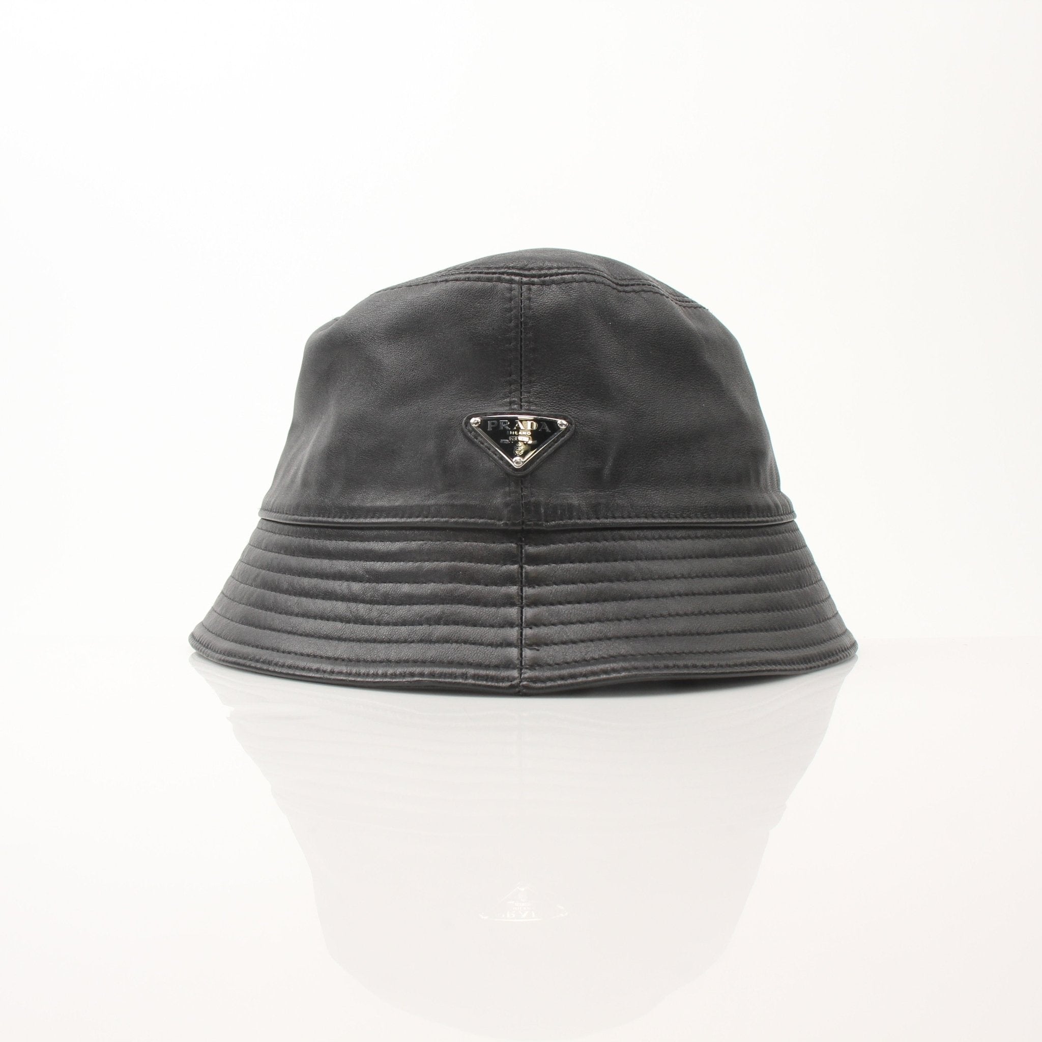 Prada black nappa leather bucket hat, stylish accessory with soft leather material, shown on a plain background.