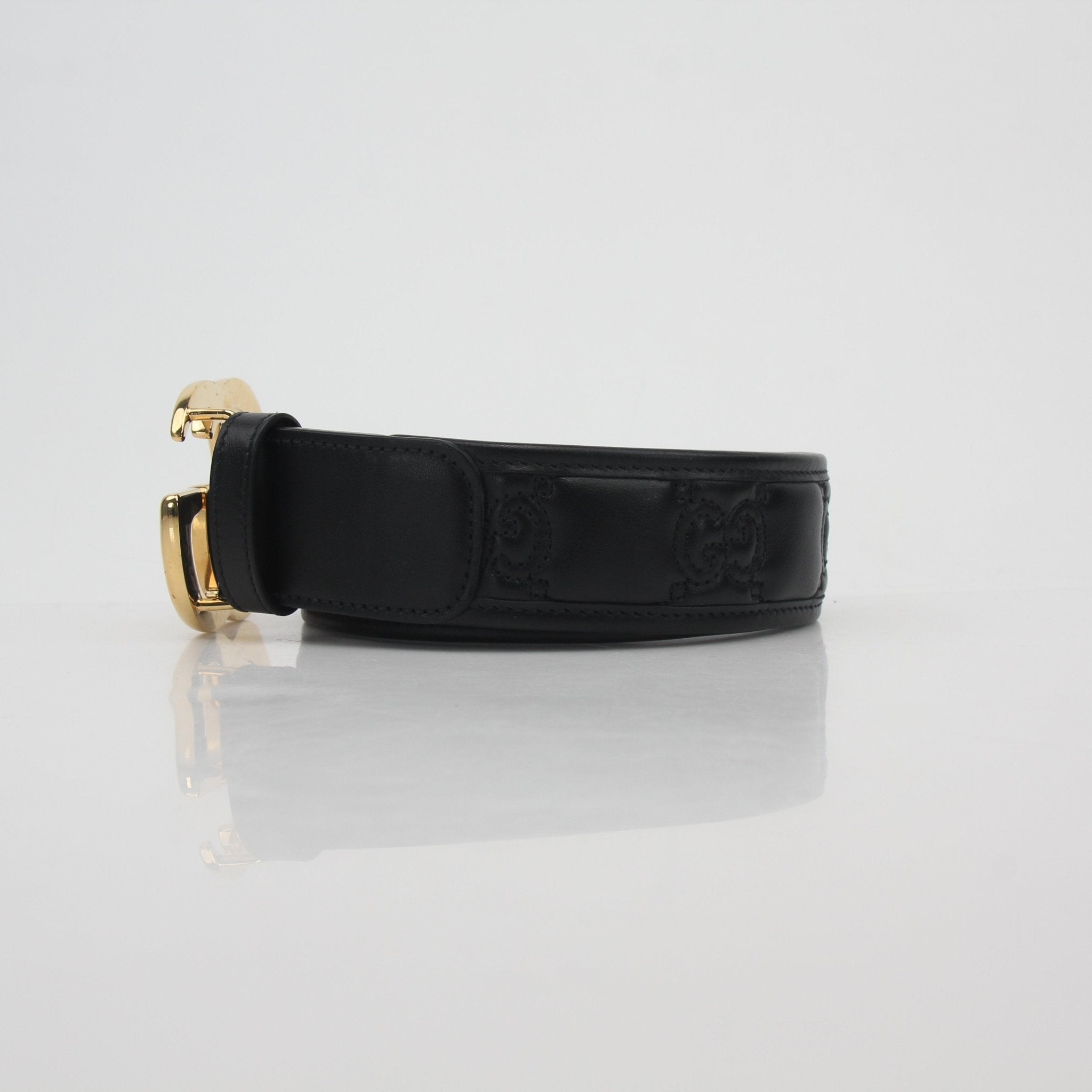 Gucci Black GG Marmont leather belt with gold hardware, stylish accessories for women.