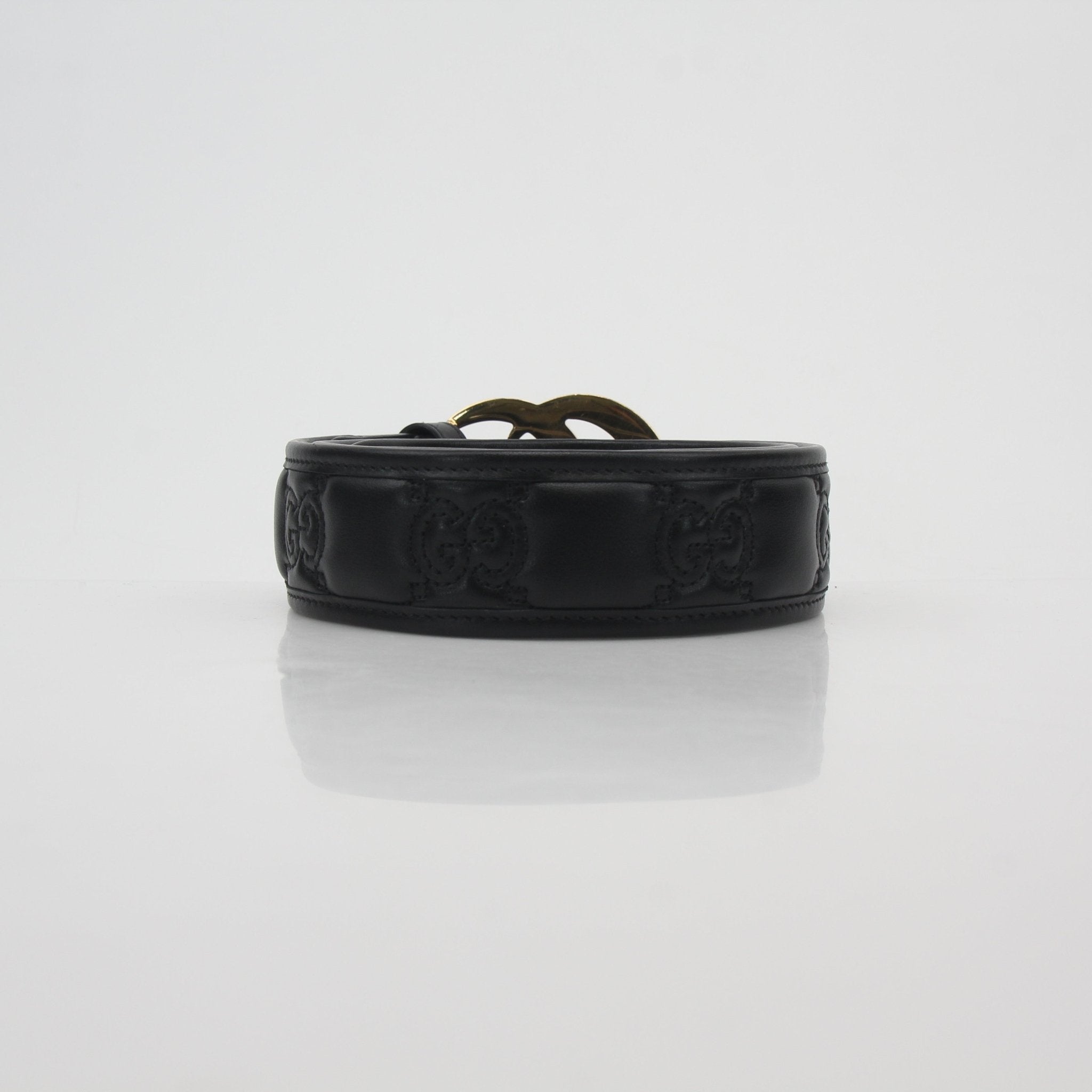 Gucci Black GG Marmont leather belt with gold hardware, stylish accessory featuring the signature GG logo buckle.