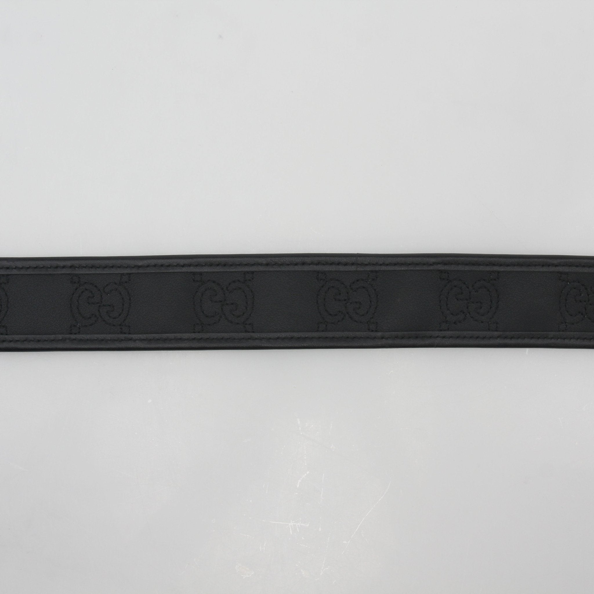 Gucci Black GG Marmont leather belt with gold-toned buckle, stylish accessories for men and women.