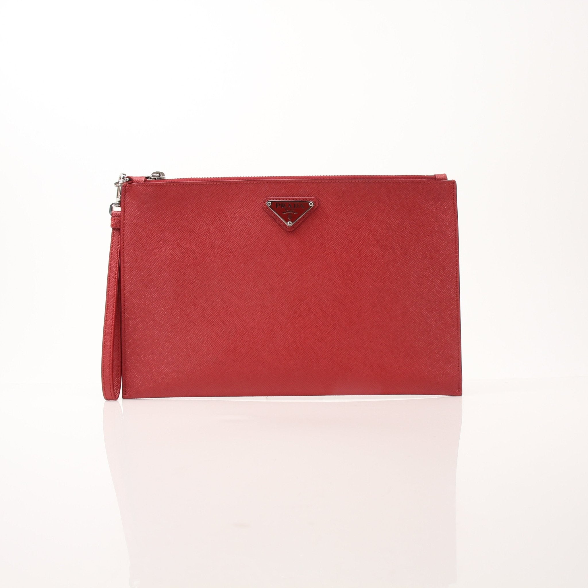 Prada red saffiano leather wristlet pouch, a stylish handbag with gold hardware and compact design, perfect for essentials.