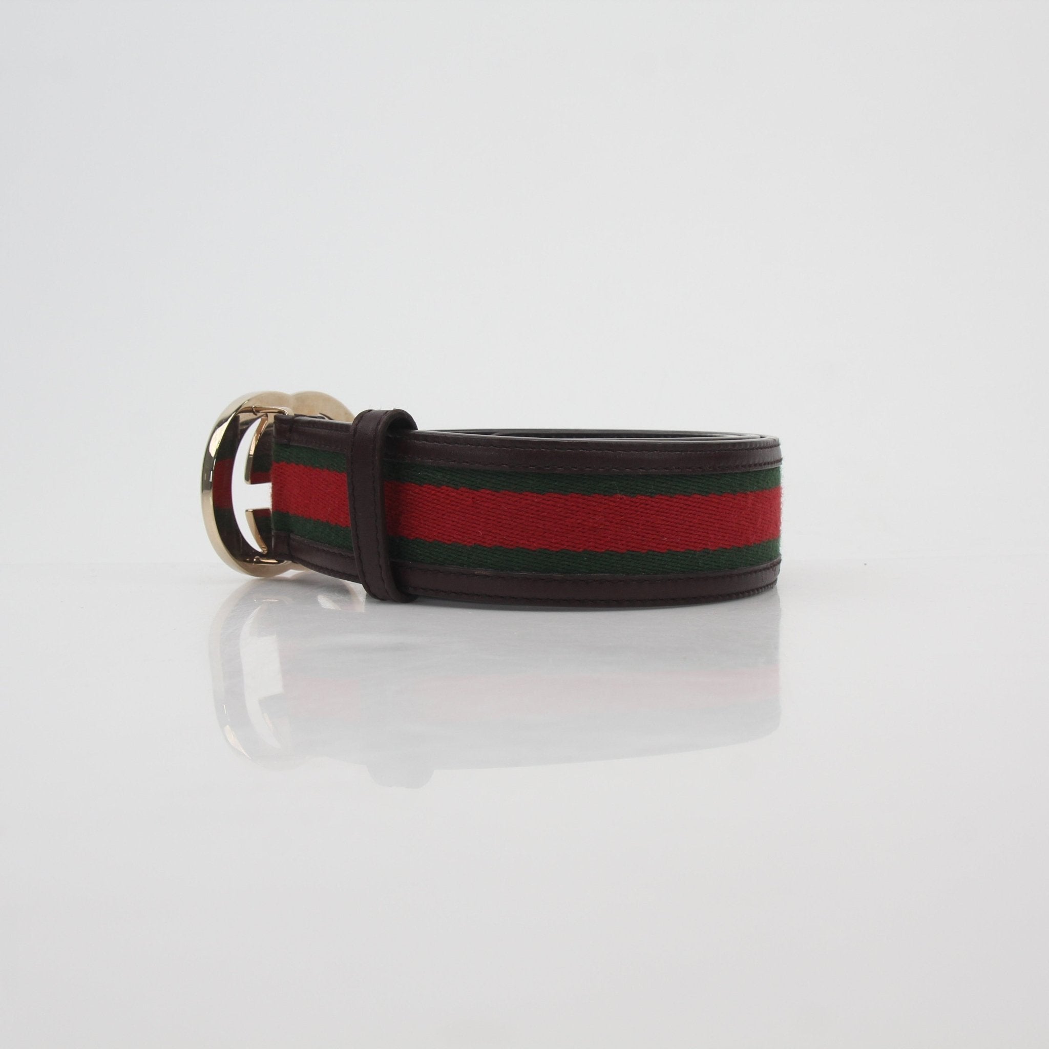 Gucci green and red interlocking G web belt with gold buckle, stylish accessories for men and women.