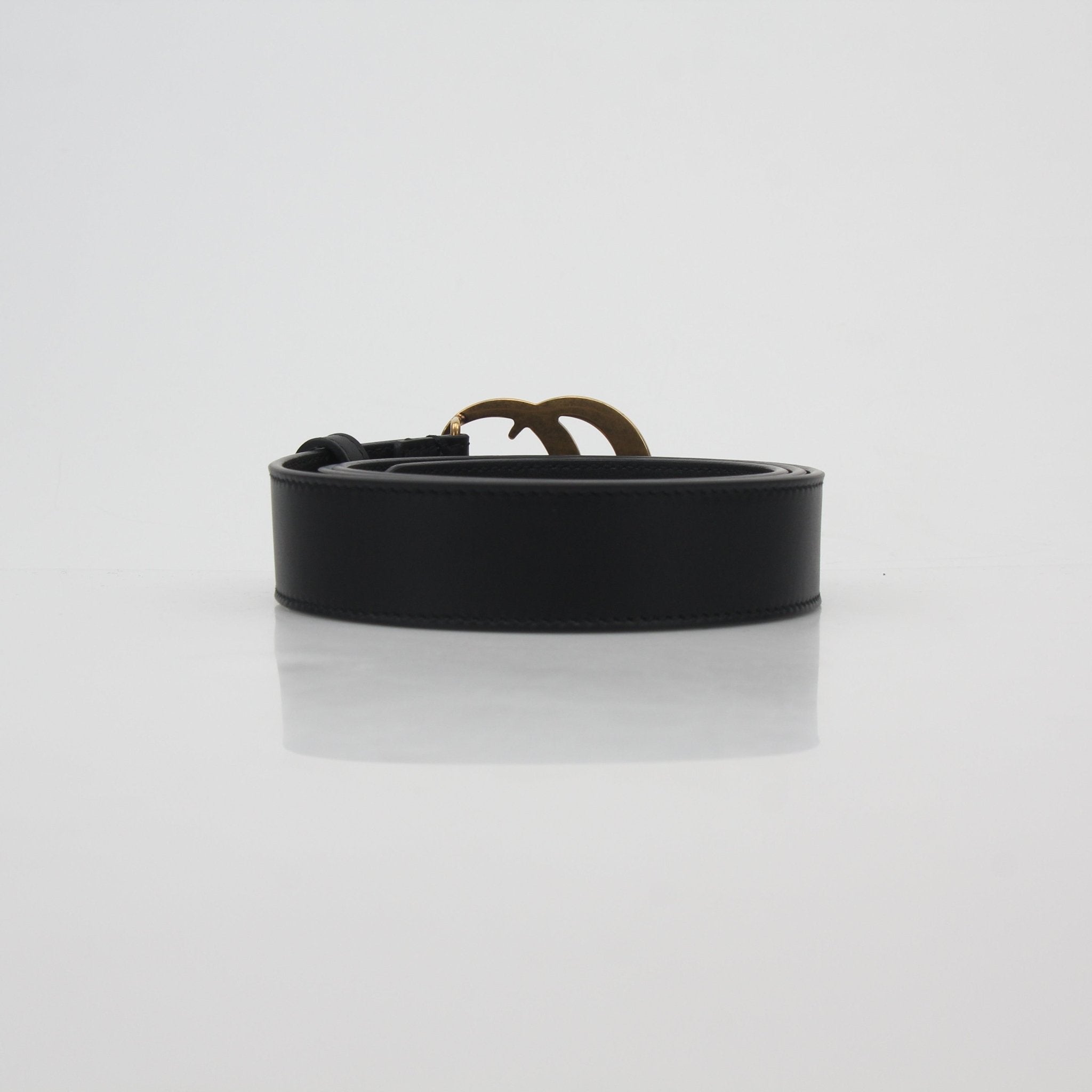 Gucci green and red interlocking G web belt with gold buckle, stylish accessories for fashion-forward outfits.