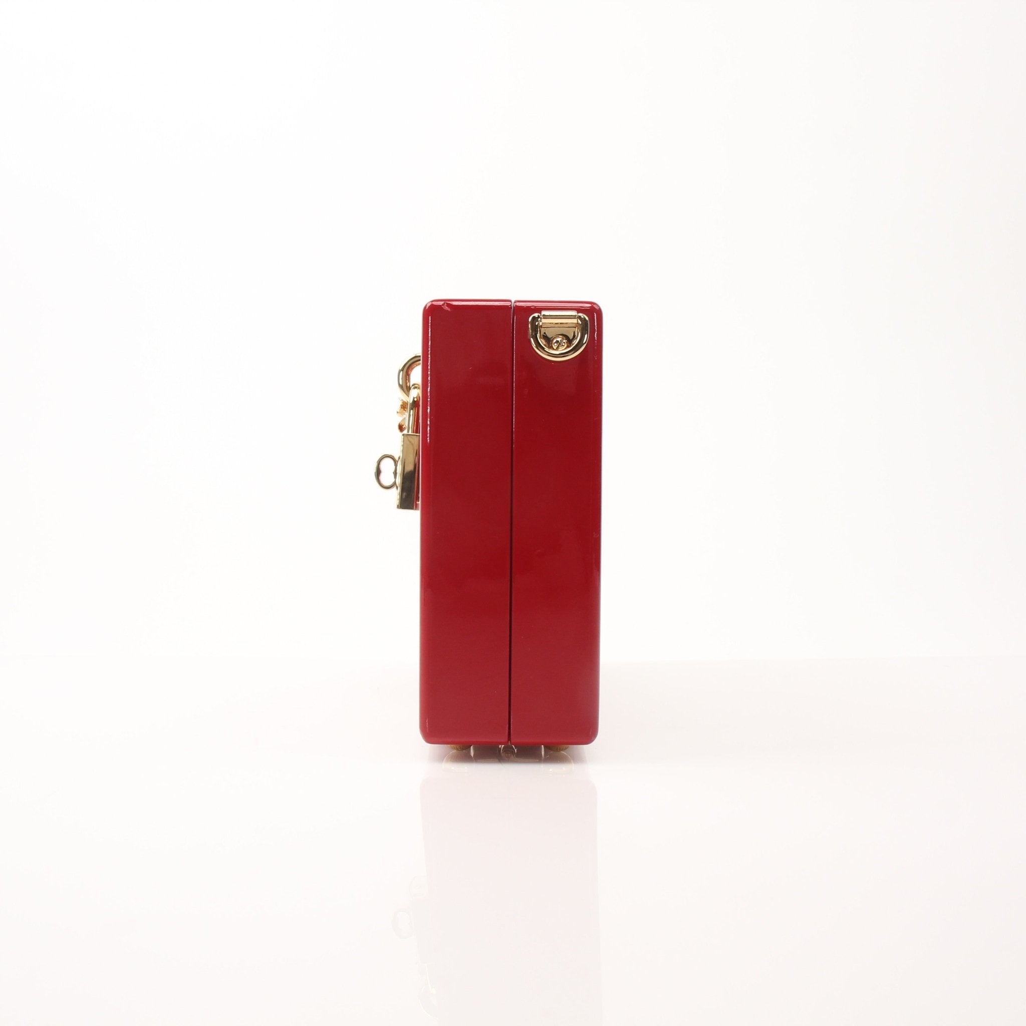 Gold & Beyond Dolce & Gabbana red graffiti box clutch handbag with bold design and structured shape.