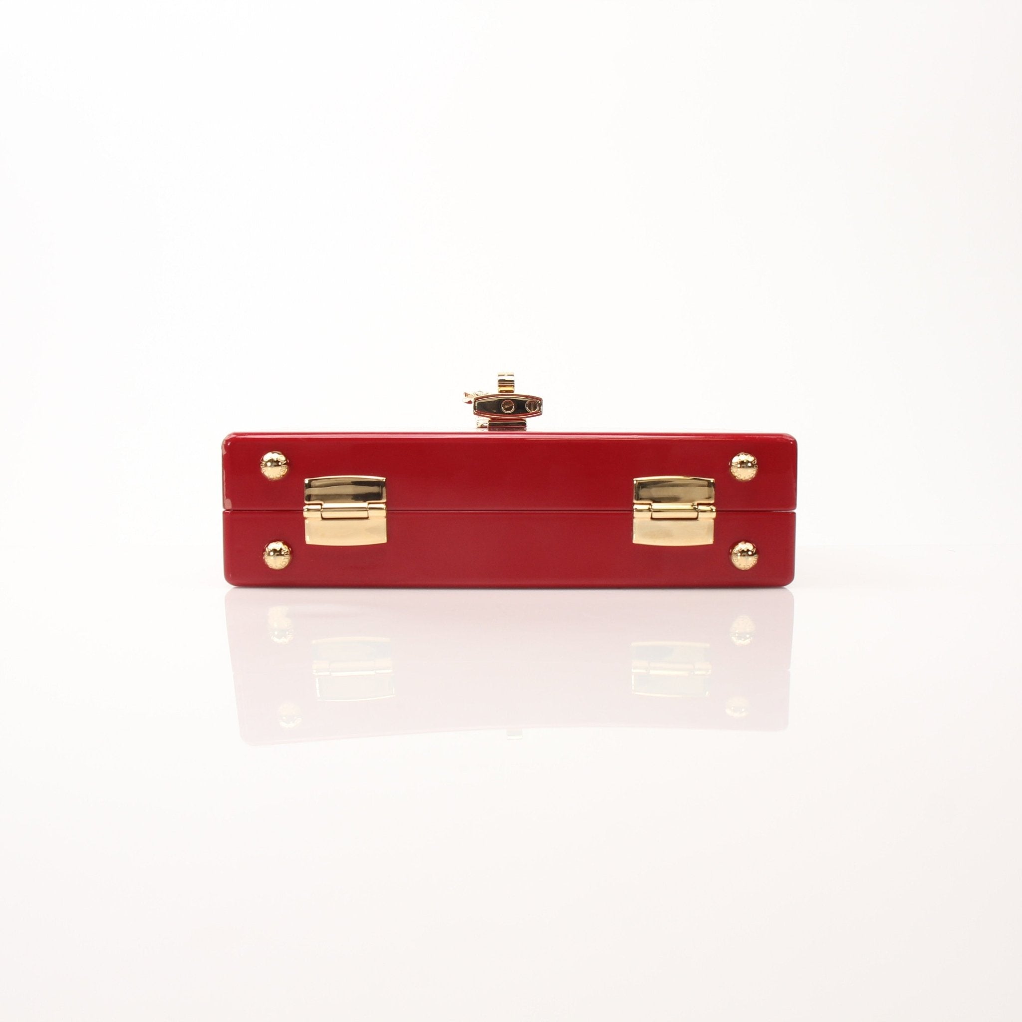 Dolce & Gabbana red graffiti box clutch handbag with gold accents and a sleek rectangular shape.