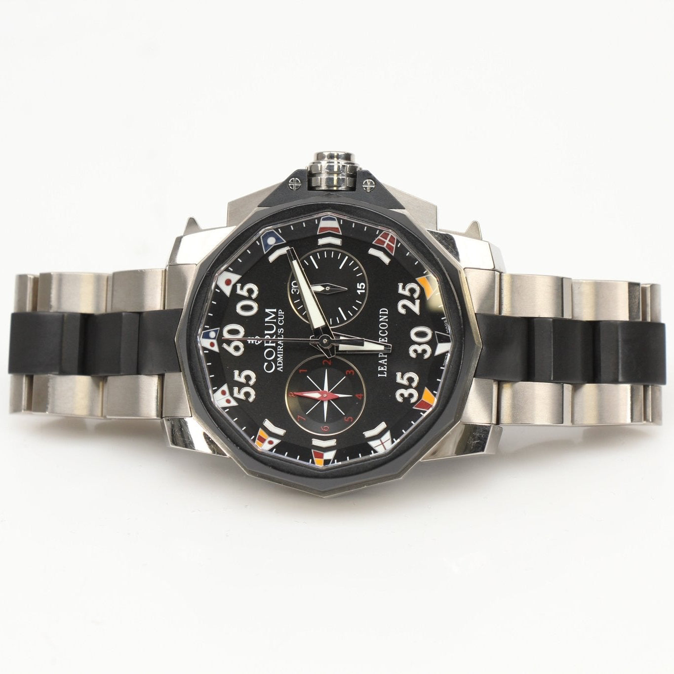Corum Admiral’s Cup Chronograph watch with stainless steel case, black dial, and silver subdials, displayed on a wrist.