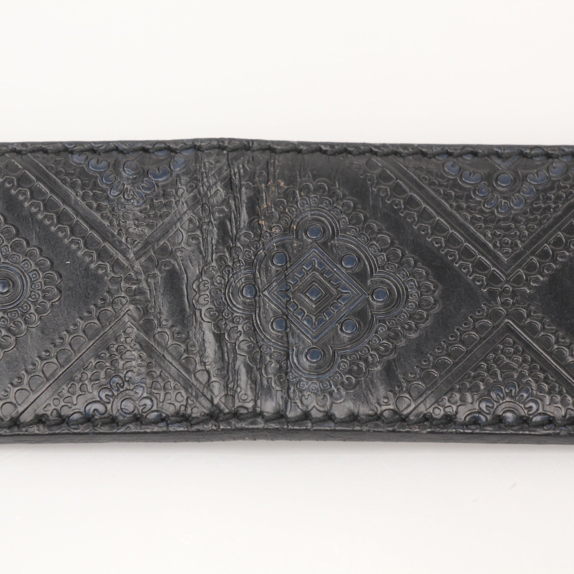 Black Prada Saffiano leather belt with gold-tone buckle, stylish accessory with textured finish and sleek design.