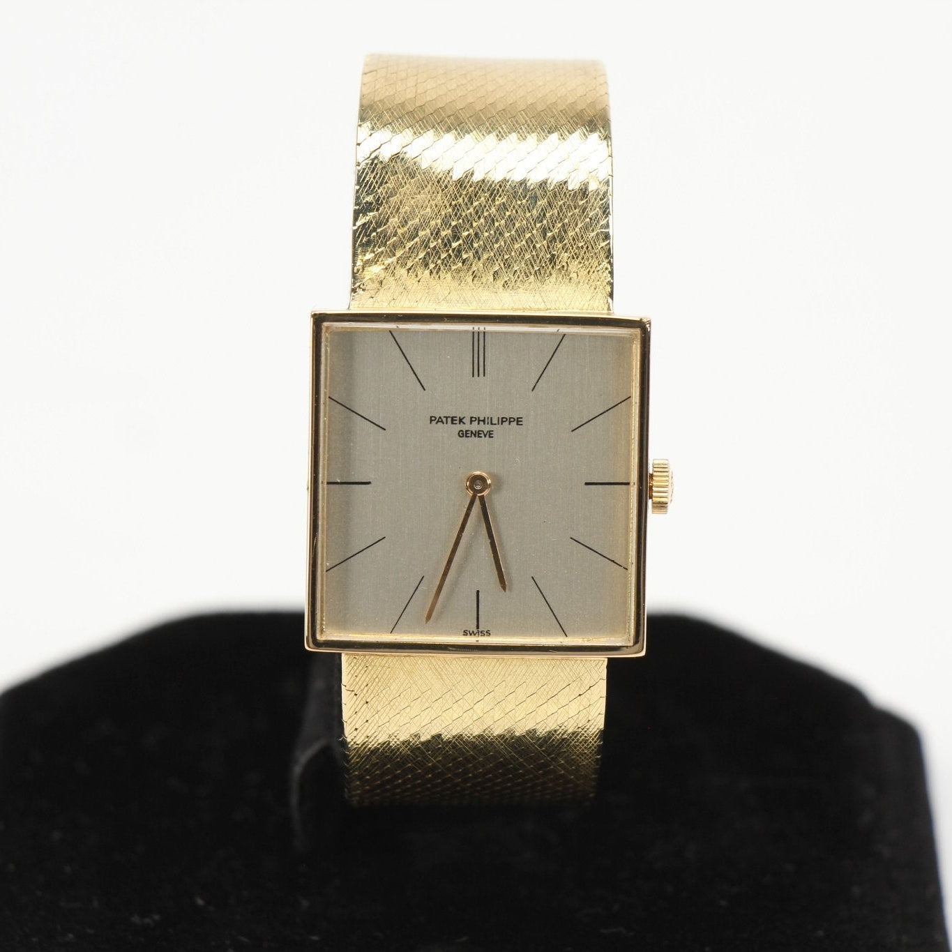 Gold & Beyond Patek Philippe square dress watch with gold case and leather strap, showcasing elegant design and classic style.