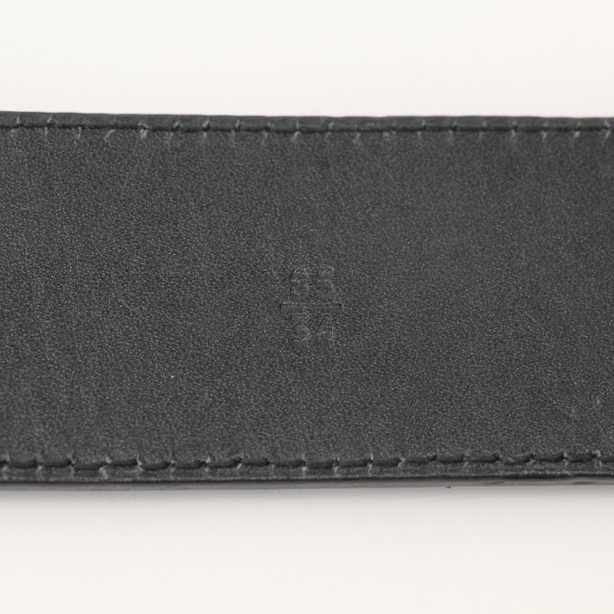 Black Prada Saffiano leather belt with gold-tone buckle, stylish accessories for men and women.