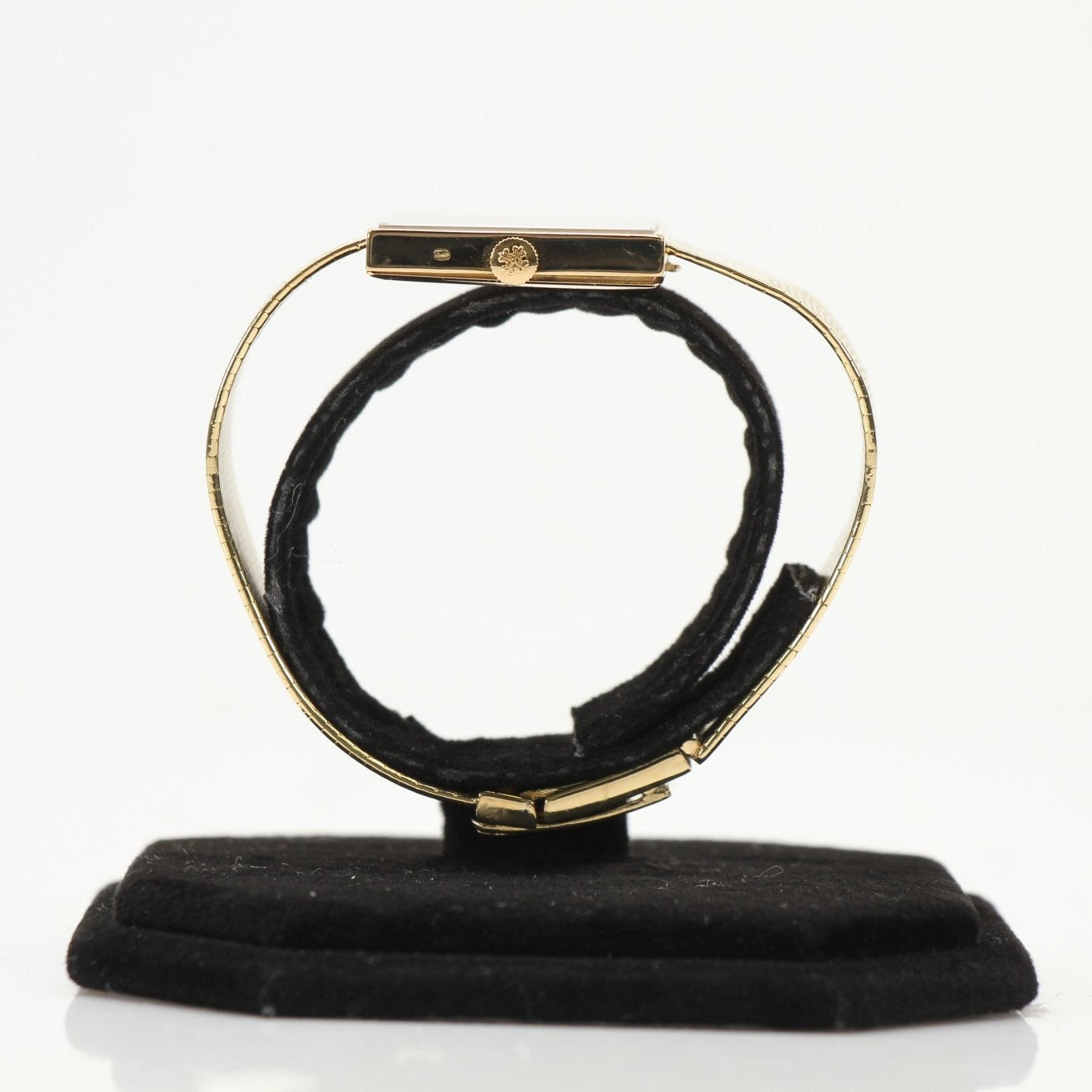 Gold & Beyond Patek Philippe square dress watch with gold case and leather strap, showcasing elegant timepiece design.