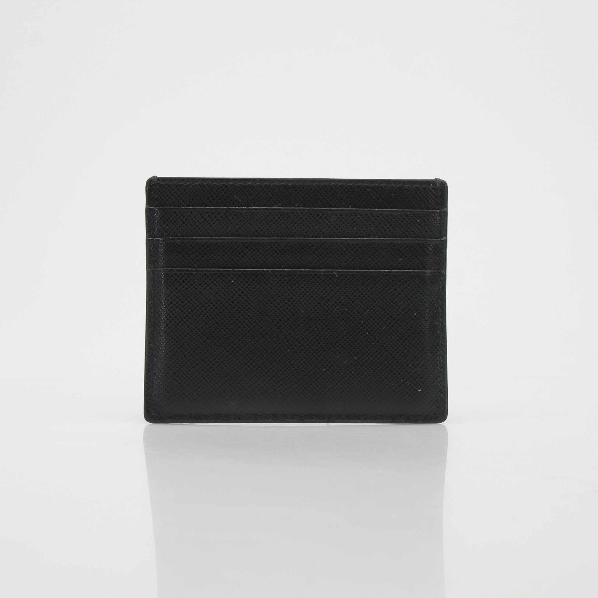 Prada black saffiano leather card holder with multiple card slots, compact and stylish for everyday use.
