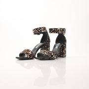 Prada pony hair leopard print block heel sandals with ankle straps, stylish women's shoes in the image.