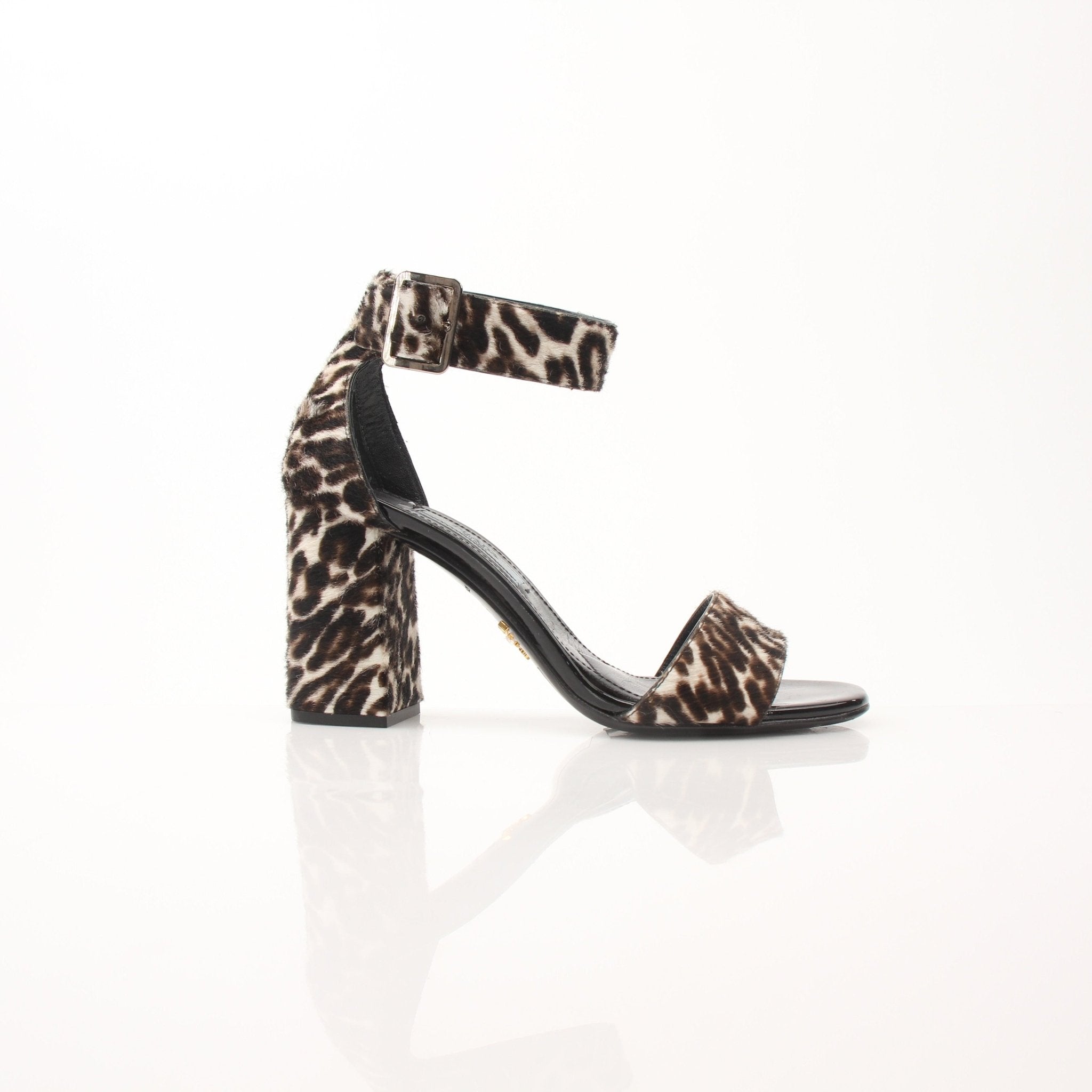 Prada pony hair leopard print block heel sandals with open toes and ankle straps, showcasing stylish luxury footwear.