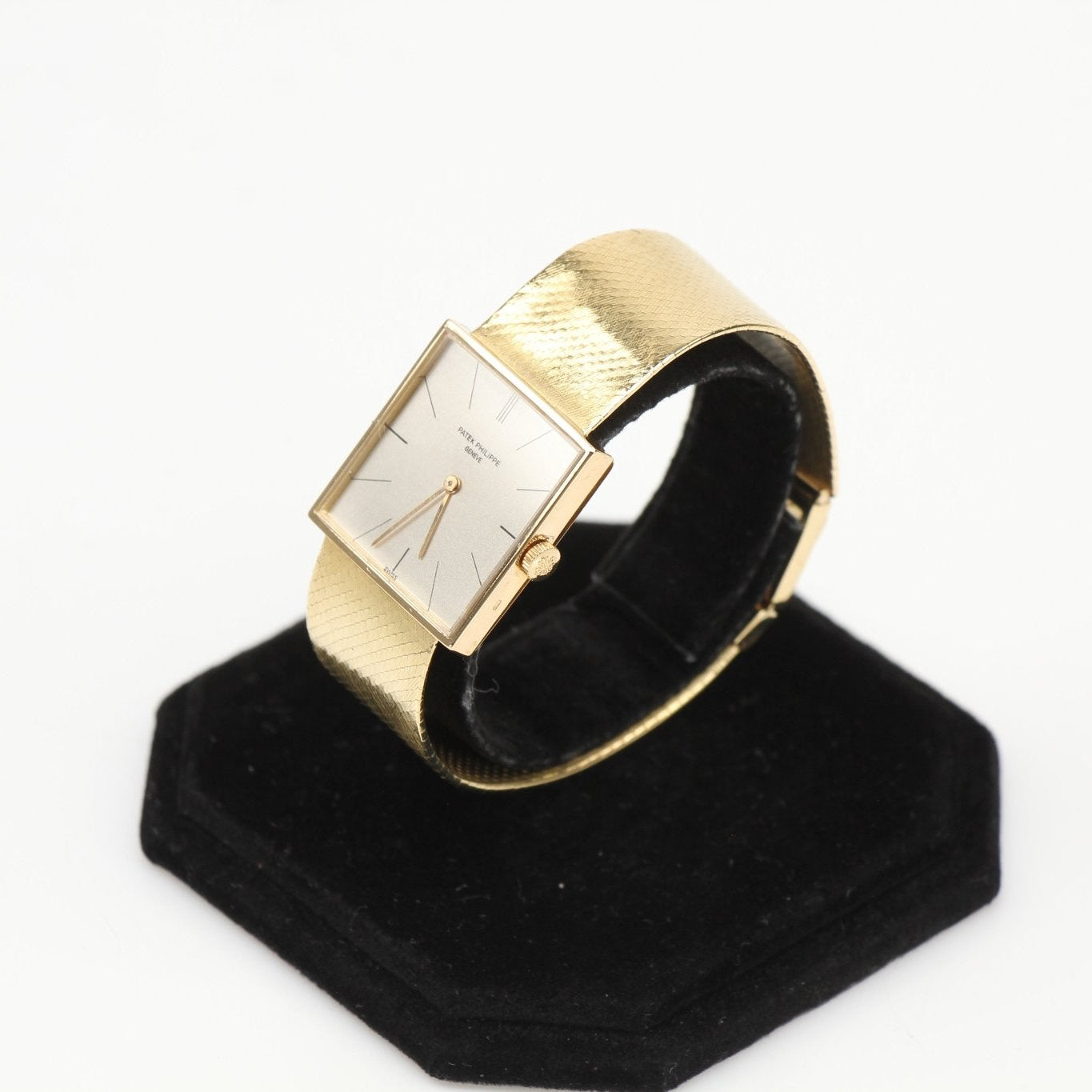 Patek Philippe square dress watch by Gold & Beyond with a sleek gold case and elegant leather strap.