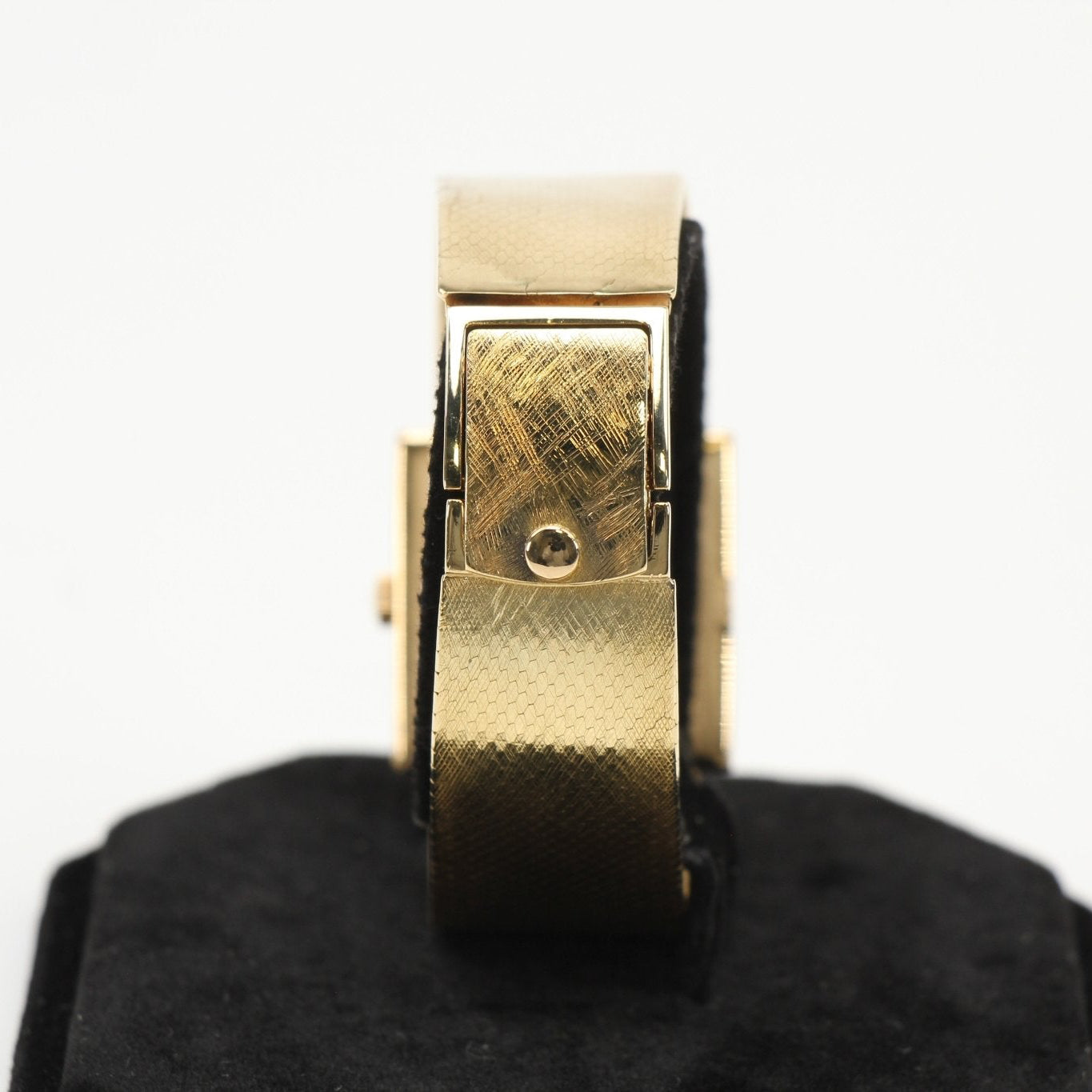 Gold & Beyond Patek Philippe square dress watch with a sleek gold case and elegant leather strap.