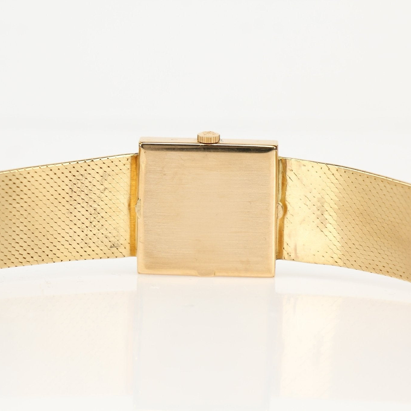 Gold & Beyond Patek Philippe square dress watch with gold case and elegant dial, showcasing a luxury timepiece for formal wear.