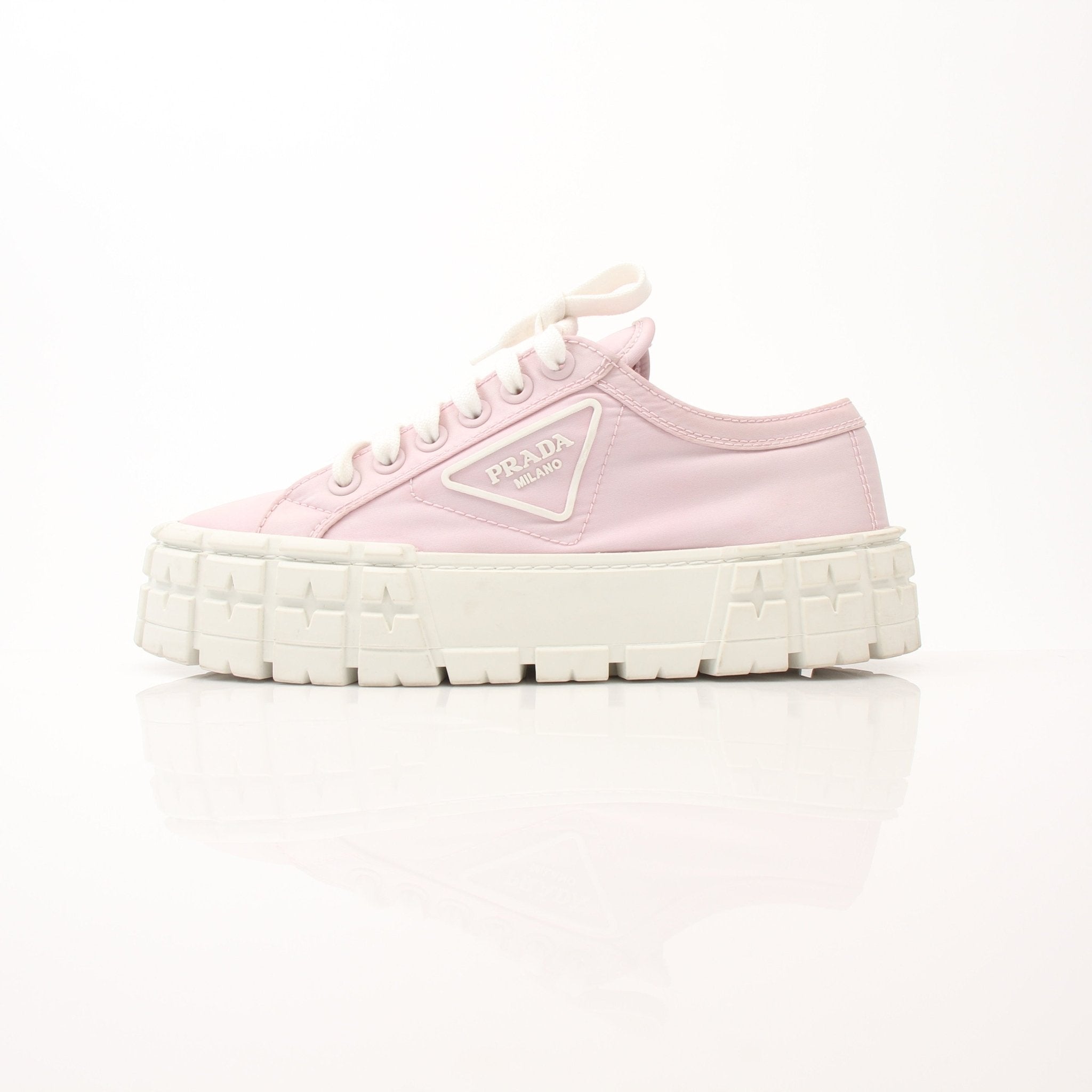 Pink Prada nylon double wheel platform sneakers with laces and chunky soles, designed for stylish casual wear.