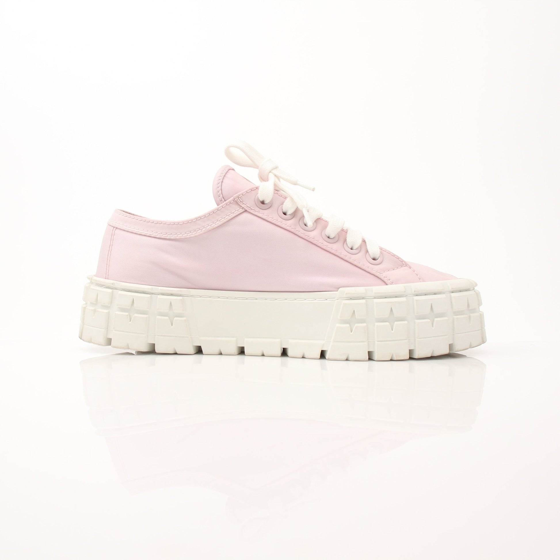 Pink Prada nylon double wheel platform sneakers with sporty design and chunky soles, displayed on a clean background.