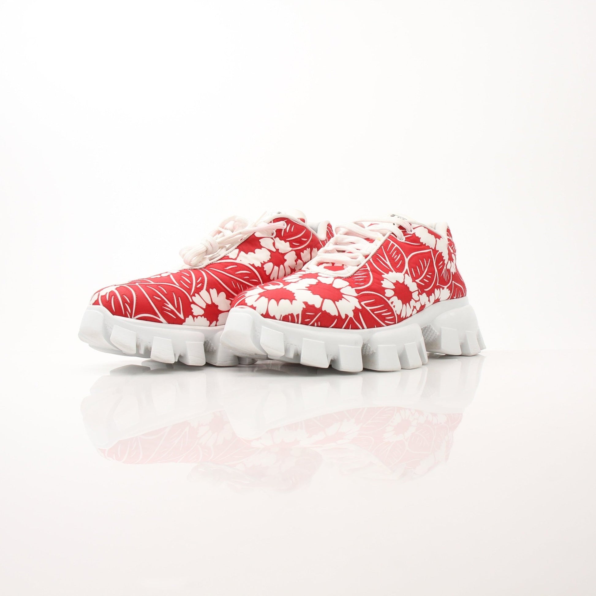 Prada Floral Monolith Lug Sole Sneakers in size 41, with bold floral design and chunky lug soles, displayed on a white background.