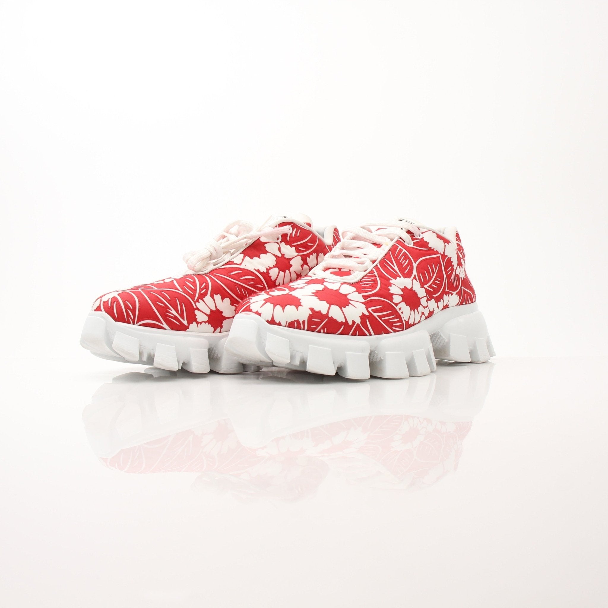 Prada Floral Monolith Lug Sole Sneakers in size 41, with bold floral design and chunky lug soles, displayed on a white background.