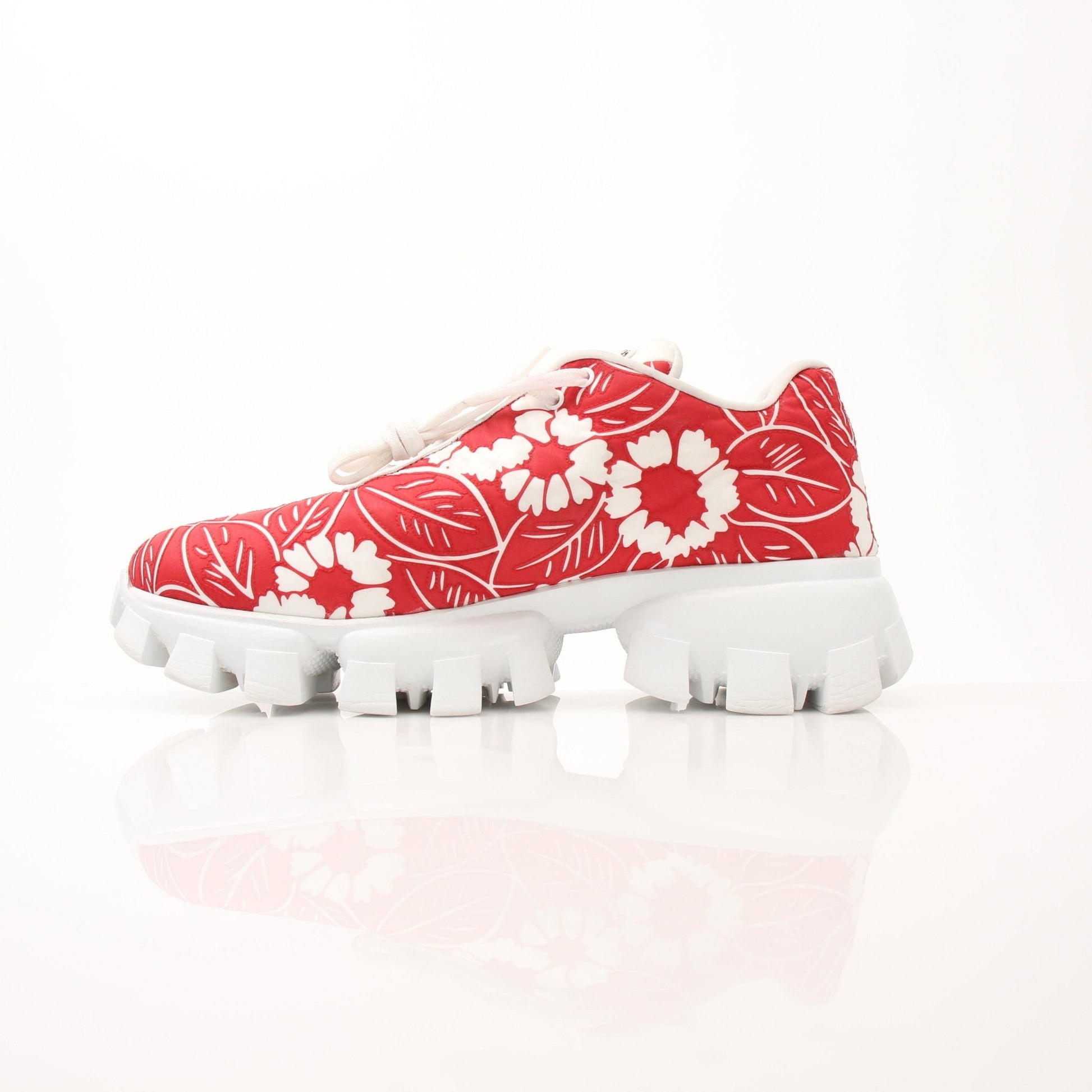 Gold & Beyond Prada floral Monolith lug sole sneakers in size 41 with colorful floral design and chunky white sole.