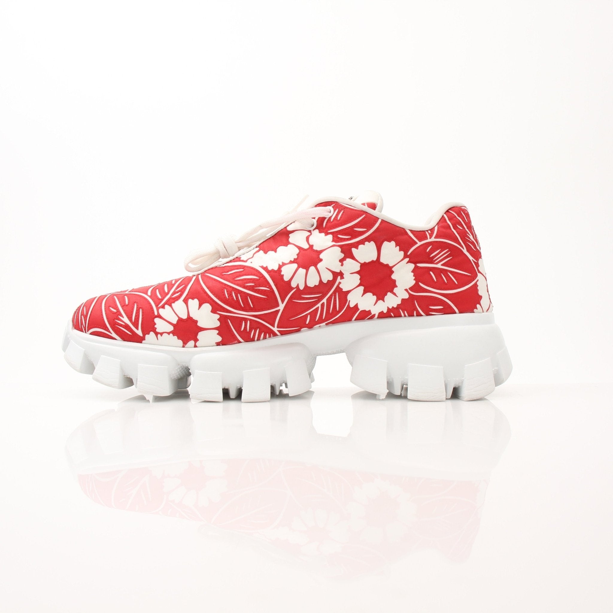 Gold & Beyond Prada floral Monolith lug sole sneakers in size 41 with colorful floral design and chunky white sole.