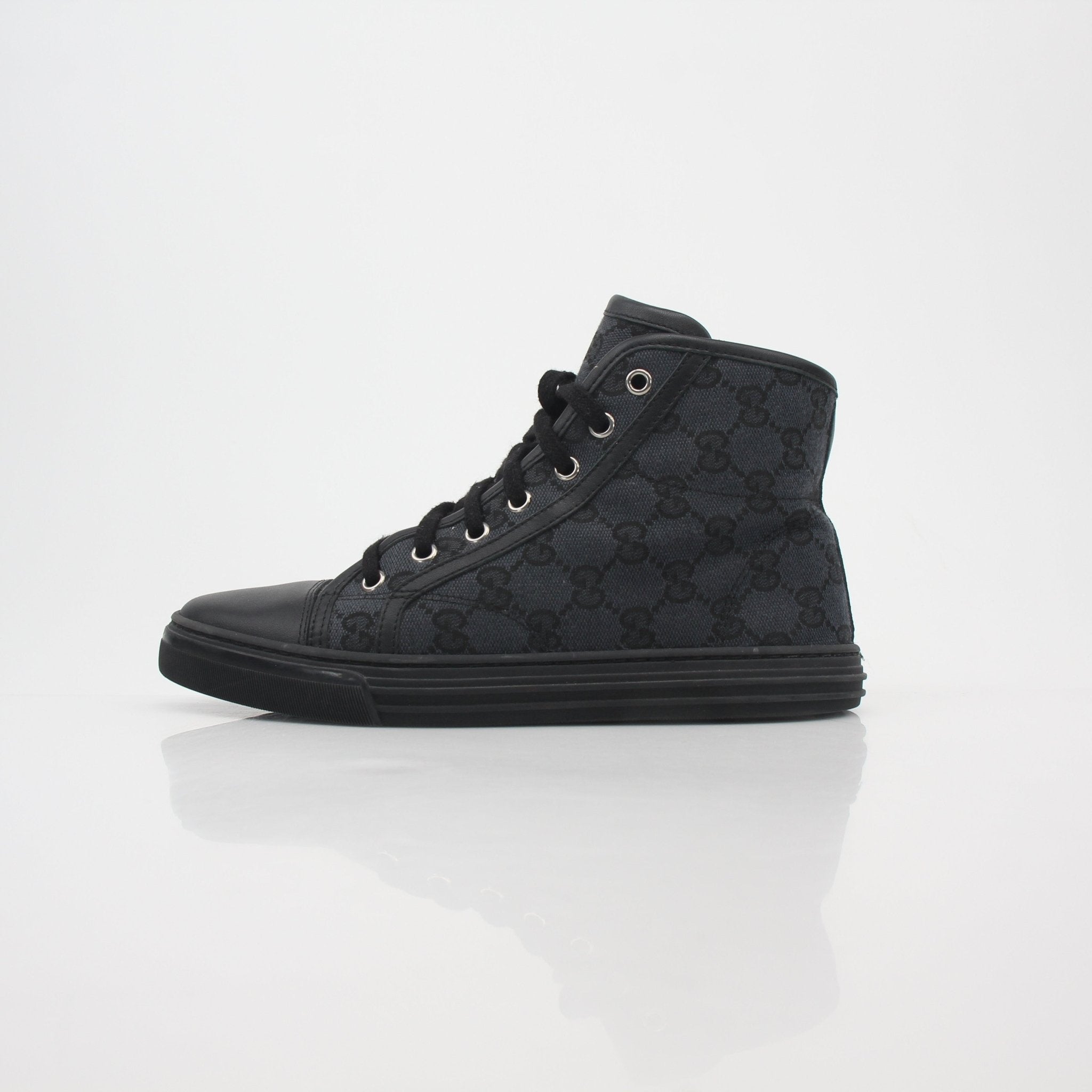 Gold & Beyond Gucci black GG canvas high-top sneakers with white soles and laces, showcasing a stylish and iconic shoe design.