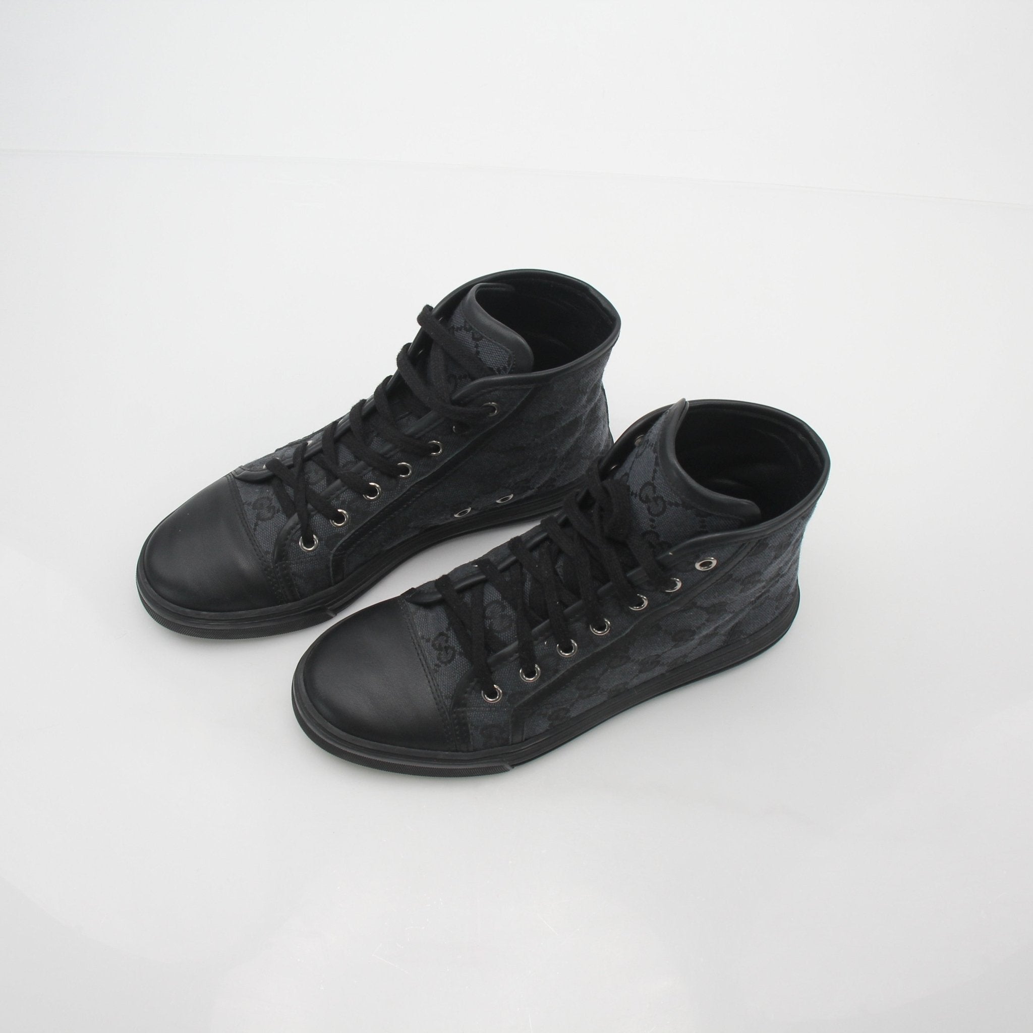 Gold & Beyond Gucci Black GG Canvas high-top sneakers with laces and stylish design, perfect for casual wear.
