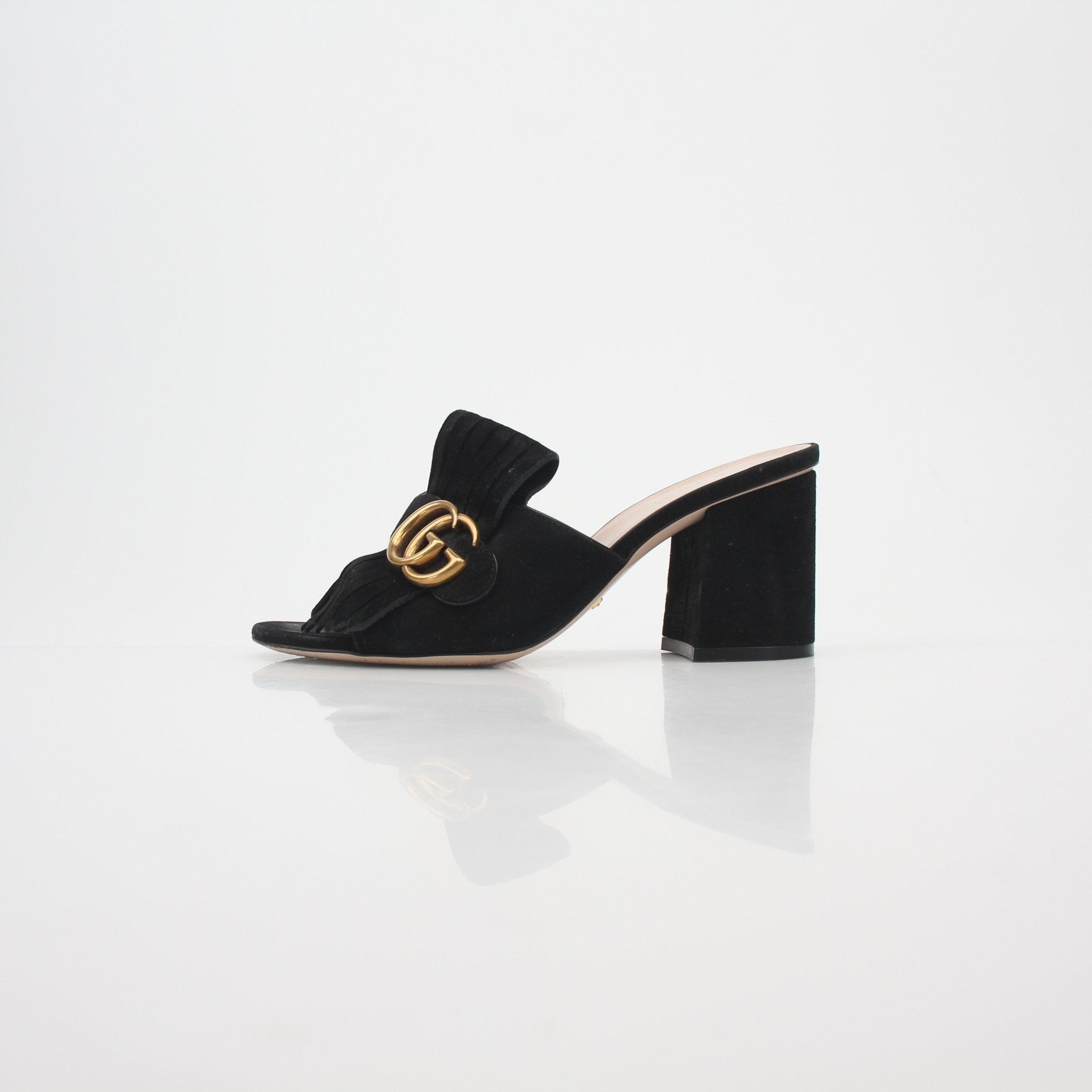Gucci Black GG Marmont Fringe Slide Sandals with gold accents, featuring quilted leather and fringe details for stylish comfort.