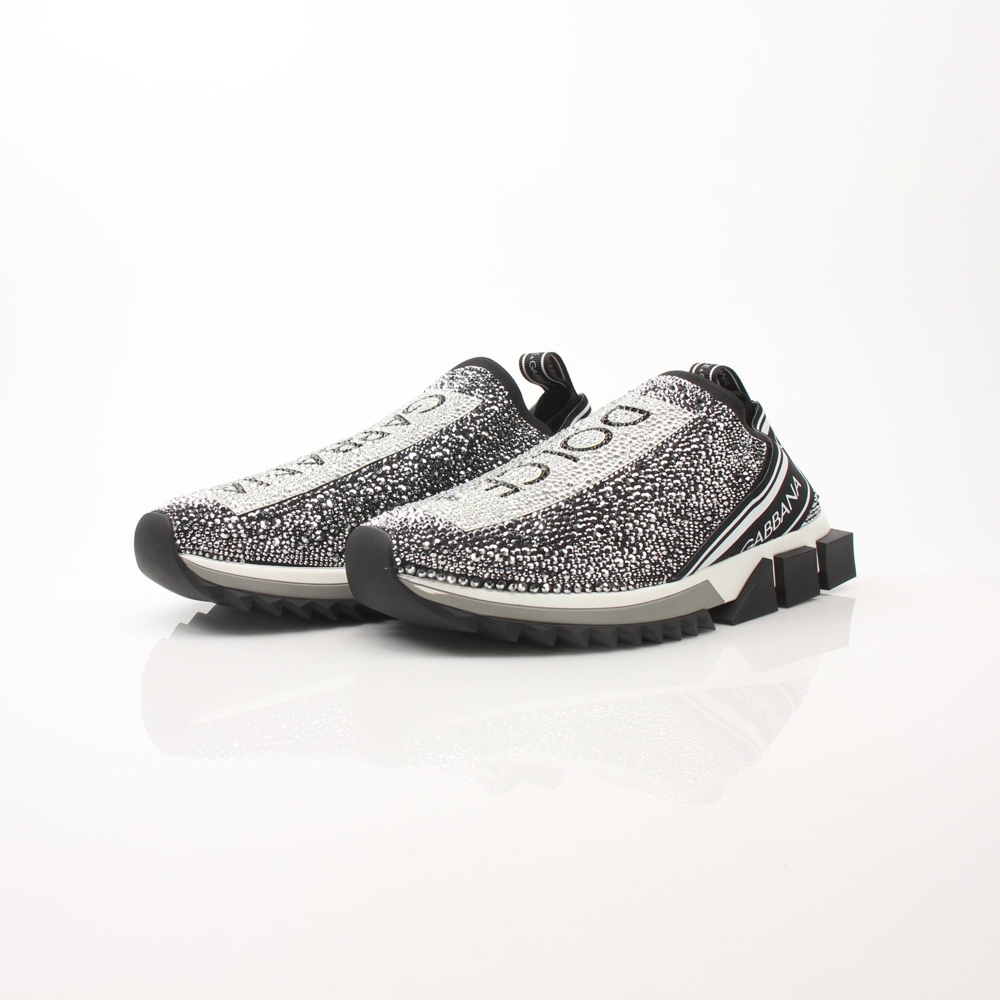 Dolce & Gabbana Sorrento Crystal Logo slip-on sneakers with crystal embellishments and white sole, designed for stylish comfort.