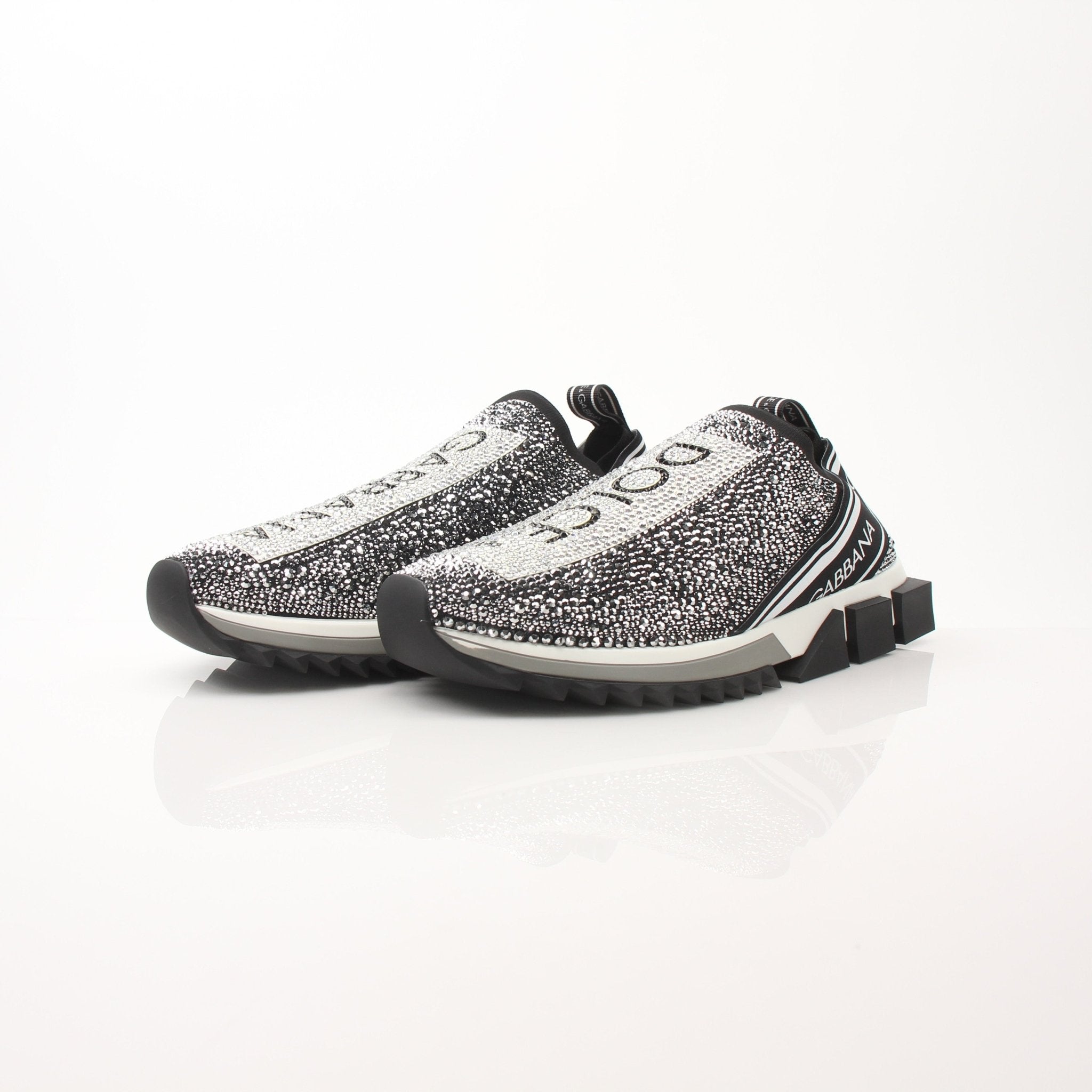 Dolce & Gabbana Sorrento Crystal Logo slip-on sneakers with crystal embellishments and white sole, designed for stylish comfort.