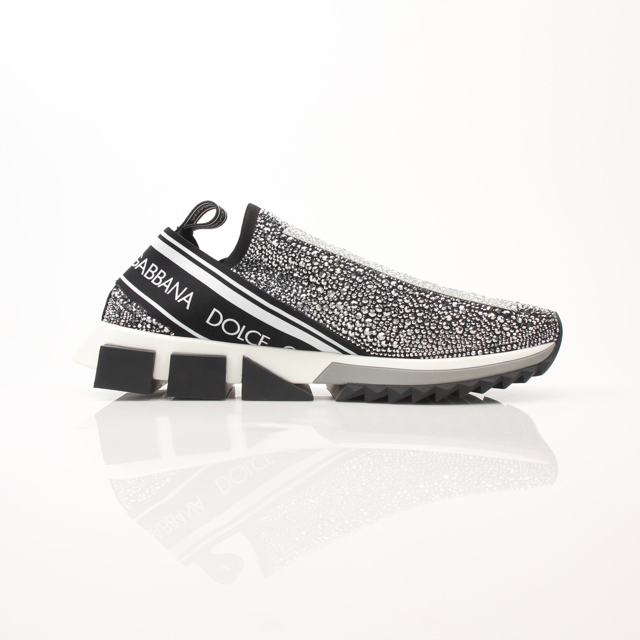 Gold & Beyond Dolce & Gabbana Sorrento Crystal Logo slip-on sneakers with crystal embellishments and sleek design.